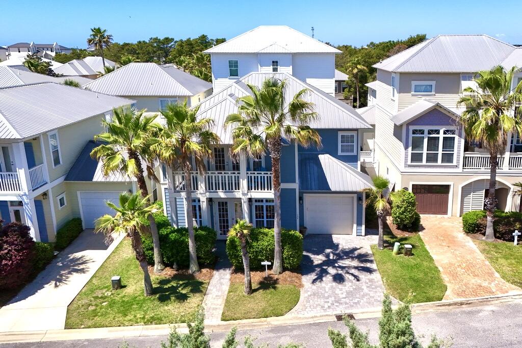 Emerald Waters Village is one of my favorite coastal neighborhoods in Miramar Beach! Upon entering the gated community, you immediately see the beautiful landscaped grounds and stunning coastal architectural designs of the homes . The community has a number of open landscaped common areas with benches, and it also features two refreshing swimming pools for your enjoyment.

As you drive up to 137 St. Francis Drive, you see a two story home with columns, a covered porch, and an upstairs private balcony. It has four bedrooms and 3 full baths. As you enter the driveway on beautiful stone pavers, which the sidewalk also features, you see that you have a one car garage available for you.

Large double doors open up the entrance way into a large open living room with tons of natural light, and a spacious dinning area. As you look around in the family room you see high ceilings, and a Shiplap feature wall, and plenty of furniture for your family and guest. You notice very quickly that this home has been well maintained. The kitchen is large with an abundance of cabinets and countertop area, which features four barstools a large kitchen table and pantry. On the first floor you also have a full bathroom and spacious bedroom with double closets. You can walk out of the kitchen into the laundry room, which has access to the back patio with stone pavers, outdoor furniture and a gas grill.

Beautiful cherry wood stairways take you up to the second floor! Upstairs you have two guest bedrooms with cherry wood flooring, walk in closets and a Jack and Jill full bathroom.

The Master Suite is very spacious, with a large walk in closet and opens up to a private balcony for your relaxing time. The Master Bathroom has double vanity's a separate tile shower and a whirlpool tub.

All of this along with being located just across the street from your private beach access to Destin's pristine beaches, equals a true hidden jewel. If you looking for a great rental producing property or a secondary home at the beach, 137 St. Francis checks off all the right boxes! Call for your private showing!