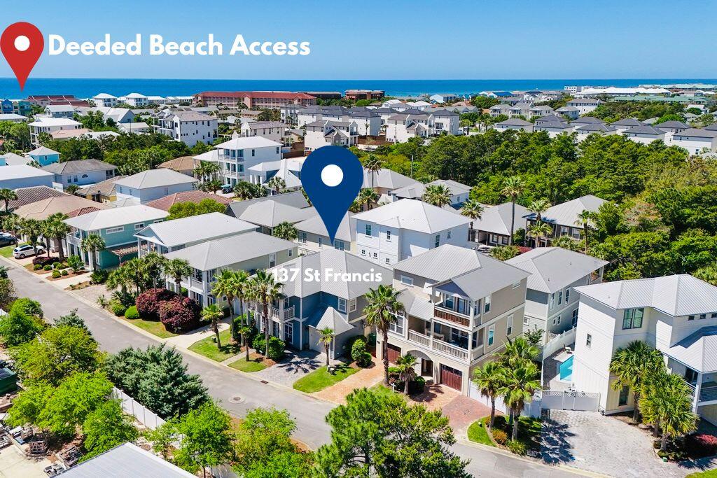 Emerald Waters Village is one of my favorite coastal neighborhoods in Miramar Beach! Upon entering the gated community, you immediately see the beautiful landscaped grounds and stunning coastal architectural designs of the homes . The community has a number of open landscaped common areas with benches, and it also features two refreshing swimming pools for your enjoyment.

As you drive up to 137 St. Francis Drive, you see a two story home with columns, a covered porch, and an upstairs private balcony. It has four bedrooms and 3 full baths. As you enter the driveway on beautiful stone pavers, which the sidewalk also features, you see that you have a one car garage available for you.

Large double doors open up the entrance way into a large open living room with tons of natural light, and a spacious dinning area. As you look around in the family room you see high ceilings, and a Shiplap feature wall, and plenty of furniture for your family and guest. You notice very quickly that this home has been well maintained. The kitchen is large with an abundance of cabinets and countertop area, which features four barstools a large kitchen table and pantry. On the first floor you also have a full bathroom and spacious bedroom with double closets. You can walk out of the kitchen into the laundry room, which has access to the back patio with stone pavers, outdoor furniture and a gas grill.

Beautiful cherry wood stairways take you up to the second floor! Upstairs you have two guest bedrooms with cherry wood flooring, walk in closets and a Jack and Jill full bathroom.

The Master Suite is very spacious, with a large walk in closet and opens up to a private balcony for your relaxing time. The Master Bathroom has double vanity's a separate tile shower and a whirlpool tub.

All of this along with being located just across the street from your private beach access to Destin's pristine beaches, equals a true hidden jewel. If you looking for a great rental producing property or a secondary home at the beach, 137 St. Francis checks off all the right boxes! Call for your private showing!