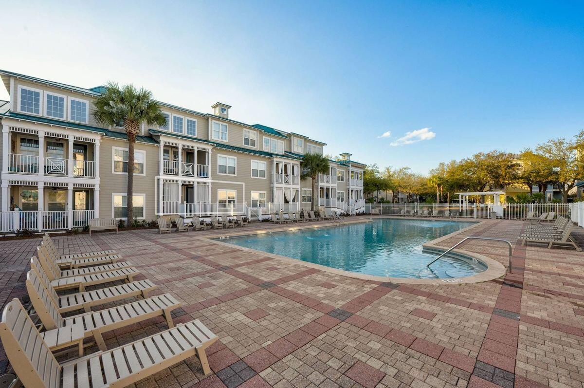 Experience the ease and charm of coastal living in this beautifully appointed ground-floor, two-bedroom condominium, ideally located along the coveted Scenic Corridor of 30A. Perfectly positioned within a private, gated community featuring both condominiums and single-family homes, this residence offers both tranquility and convenience in one of the Emerald Coast's most sought-after settings. Just steps from your door, enjoy immediate access to the sparkling community pool and well-equipped fitness center, creating the feel of a private resort just outside your patio. The location is truly exceptional, with several beloved local establishments within walking or biking distance, including Mimmo's Italian restaurant, a health-conscious deli, and several additional dining spots nearby. The sugar-white sands and emerald waters of the Gulf are also just a short distance away, with beach access located within approximately five blocks. Inside, the condominium has been tastefully decorated and thoughtfully furnished, and it is being offered fully furnished, providing a seamless opportunity for immediate enjoyment as a primary residence, second home, or investment property.  Residents and guests will also appreciate the ample parking, adding to the convenience and welcoming atmosphere of this charming 30A community.