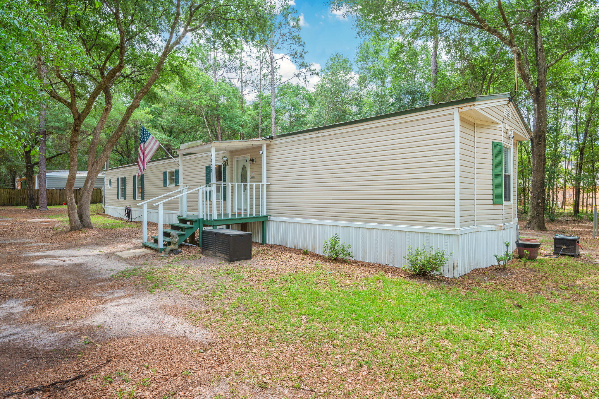 Move right into this thoughtfully updated East Milton home, available fully furnished if desired! Situated on nearly half an acre with quick access to I-10, this 3-bedroom, 2-bath property offers the perfect combination of modern comforts, country charm, and everyday convenience.

The inviting interior features an updated kitchen with stainless steel appliances, abundant cabinetry, and plenty of storage space. A separate laundry area adds functionality, while sliding glass doors lead to a covered back deck, creating the perfect space for outdoor entertaining or relaxing while enjoying the peaceful surroundings.

The spacious primary suite serves as a private retreat, complete with a garden tub, separate shower, and double vanity. Kitchen appliances, washer, and dryer all convey with the sale.

Outside, you'll find a storage shed and an RV hookup conveniently located on the right side of the property, providing added flexibility for guests, travel enthusiasts, or extra storage needs.