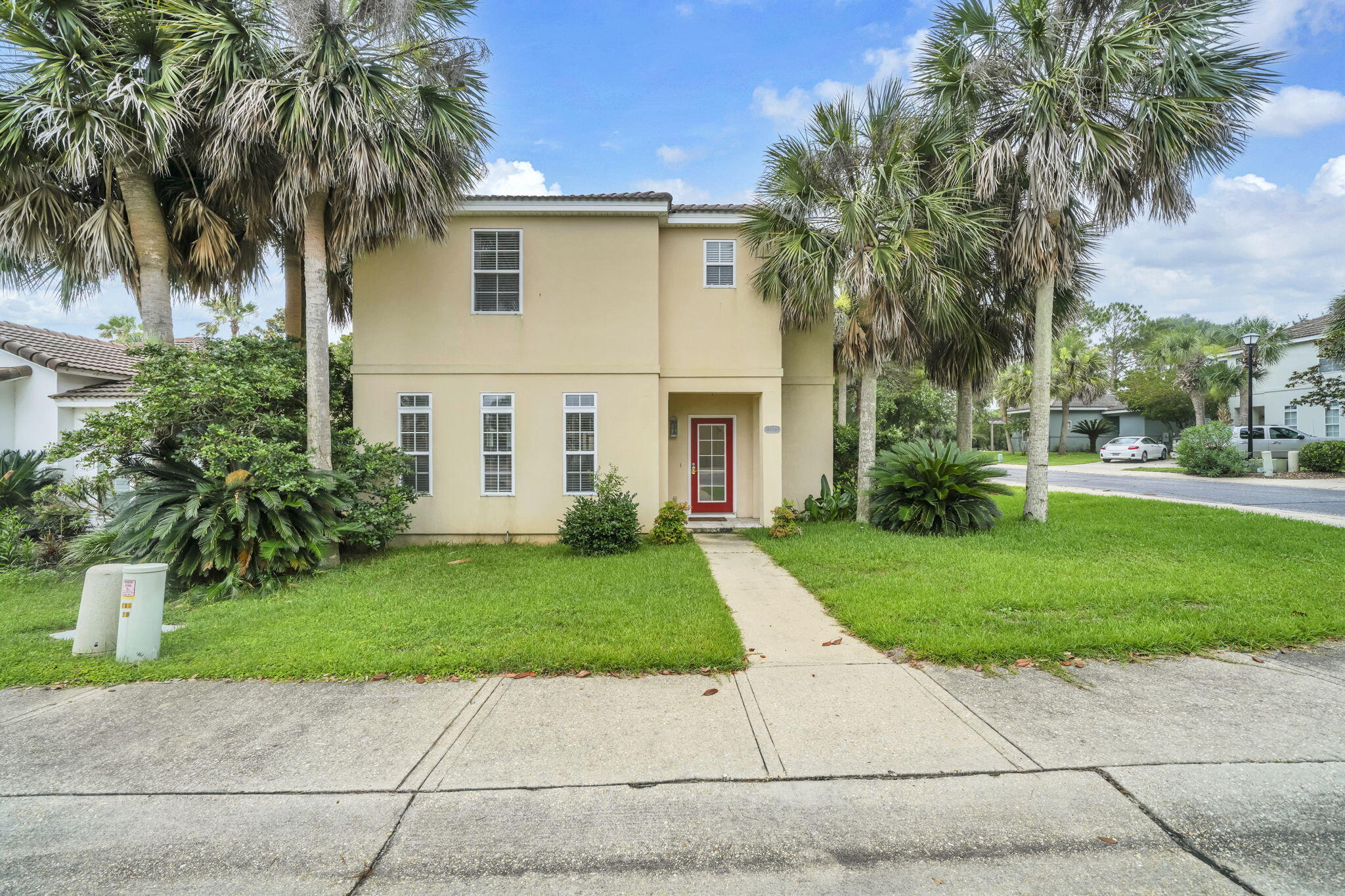 Ideally located just minutes from premier shopping, dining, entertainment, and the sugar-white beaches of the Emerald Coast, this beautifully maintained Mediterranean-style stucco home offers the perfect blend of elegance, comfort, and convenience.

Nestled on a desirable corner lot within the gated Tuscany community, an intimate neighborhood of fewer than 50 homes, this spacious residence features 3 bedrooms, 2.5 bathrooms, and 2,118 square feet of thoughtfully designed living space.

The main level welcomes you with soaring ceilings and an open-concept layout that seamlessly connects the living, dining, and kitchen areas, creating an inviting space for both everyday living and entertaining. The well-appointed kitchen features granite countertops, abundant cabinetry, and tile flooring, while the screened porch provides the perfect setting to enjoy morning coffee or unwind in the evenings.

Upstairs, the private primary suite offers a peaceful retreat with generous space and privacy. Two freshly painted guest bedrooms and an open hallway overlooking the dramatic living area below enhance the home's bright, airy atmosphere.

Residents enjoy the privacy and security of this exclusive gated community of fewer than 50 homes, along with access to a sparkling community pool. Conveniently located just minutes from Destin's renowned beaches, championship golf courses, shopping, dining, and entertainment, this home is ideal as a primary residence, second home, or investment property.