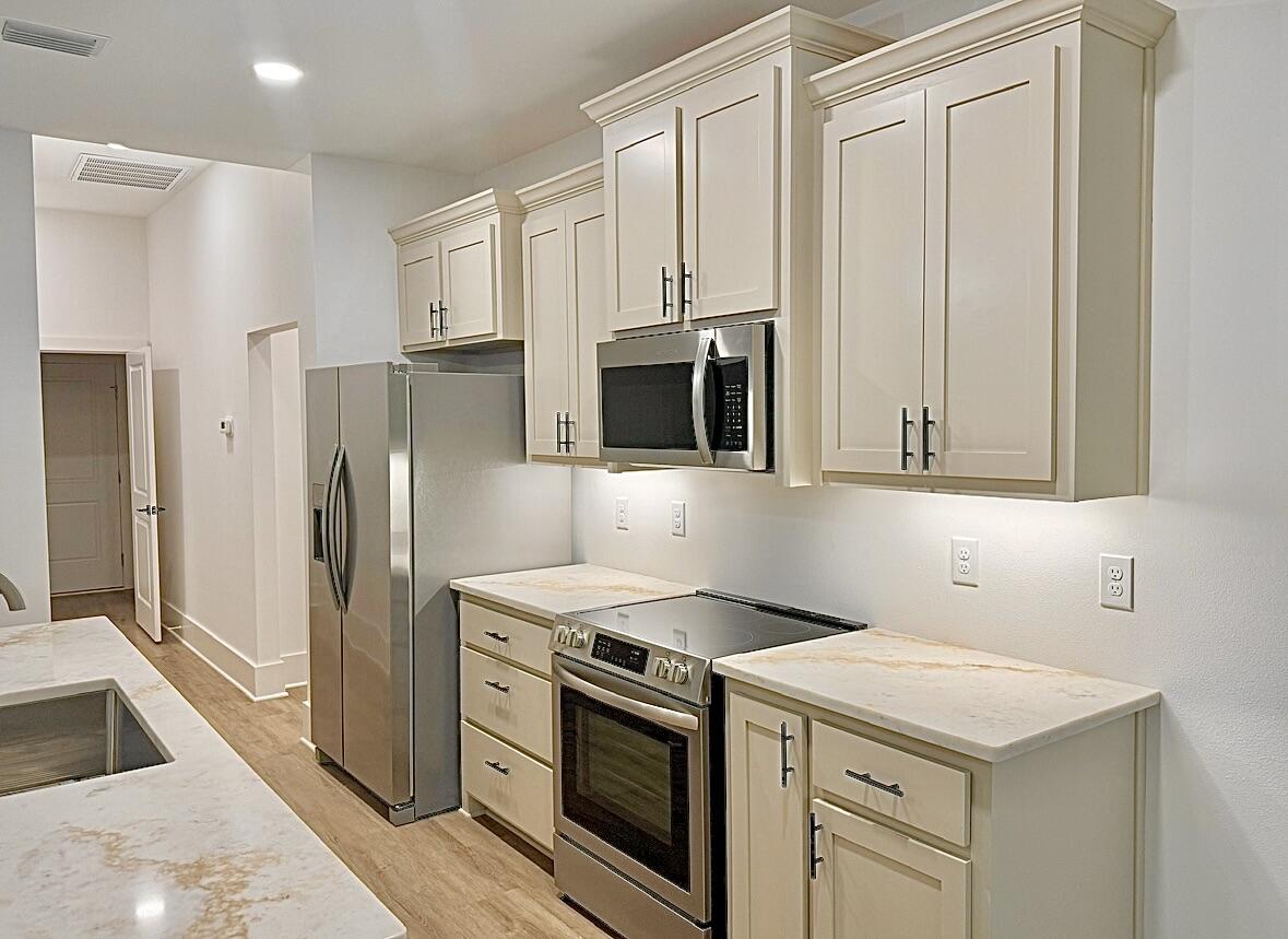 Welcome to 6647 DeSoto Street in the highly sought-after Holley by the Sea community! This beautifully crafted 4-bedroom, 2.5-bath home offers 1,979 square feet of thoughtfully designed living space with quality finishes throughout. The open-concept layout features luxury vinyl plank flooring, custom cabinetry, a spacious kitchen perfect for entertaining, and abundant natural light. The private primary suite provides a relaxing retreat, while the additional bedrooms offer flexibility for family, guests, or a home office. Enjoy the covered back porch, 2-car garage, city water, and septic system. As a resident of Holley by the Sea, you'll have access to exceptional amenities including multiple pools, tennis and pickleball courts, fitness facilities, parks, walking trails, and more. Conveniently located near Navarre Beach, Hurlburt Field, shopping, dining, and top-rated schools, this move-in-ready home offers the perfect blend of comfort, quality, and coastal living. Schedule your private showing today!