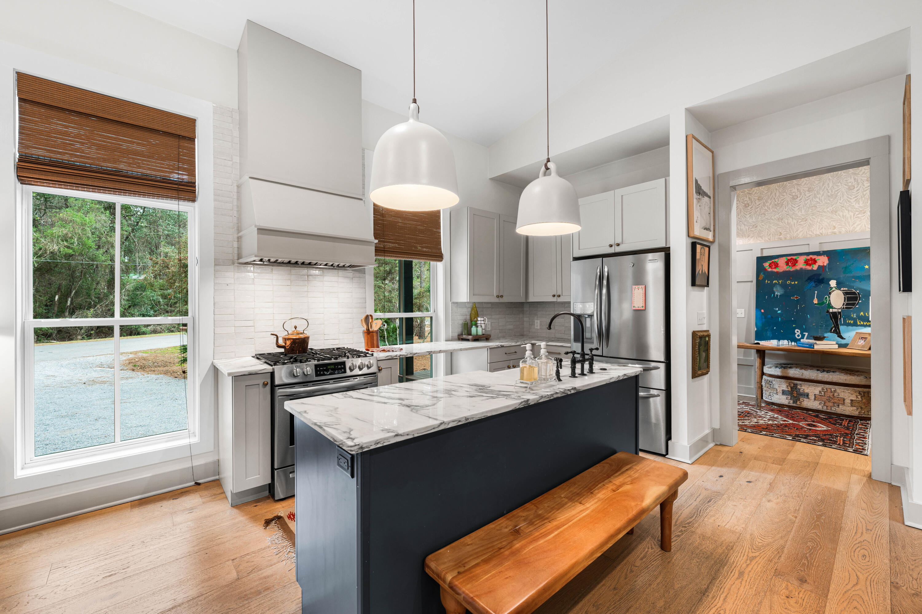 Welcome to simplified coastal living at 294 West Point Washington Road in Santa Rosa Beach, FL. Tucked among mature trees and set along a peaceful canal just minutes from the emerald waters and white sands of the Gulf, this custom home blends modern style with laid-back waterfront vibes. Step inside to an elegant, open layout designed for both everyday life and seamless entertaining. The kitchen offers sleek finishes, custom cabinetry, granite countertops and high-end appliances, making it perfect for cooking daily meals or hosting friends and family. The living space is filled with natural light and relaxing water views, creating a serene, airy feel throughout the home. Slide outside to the screened porch for morning coffee or unwind in the spacious outdoor area gathering around the firepit or chilling on the dock. With warm hardwood floors, a modern, functional kitchen, and stylish bathrooms this home feels fresh, elevated, and totally move-in ready. Don't miss the opportunity to call this one your own.