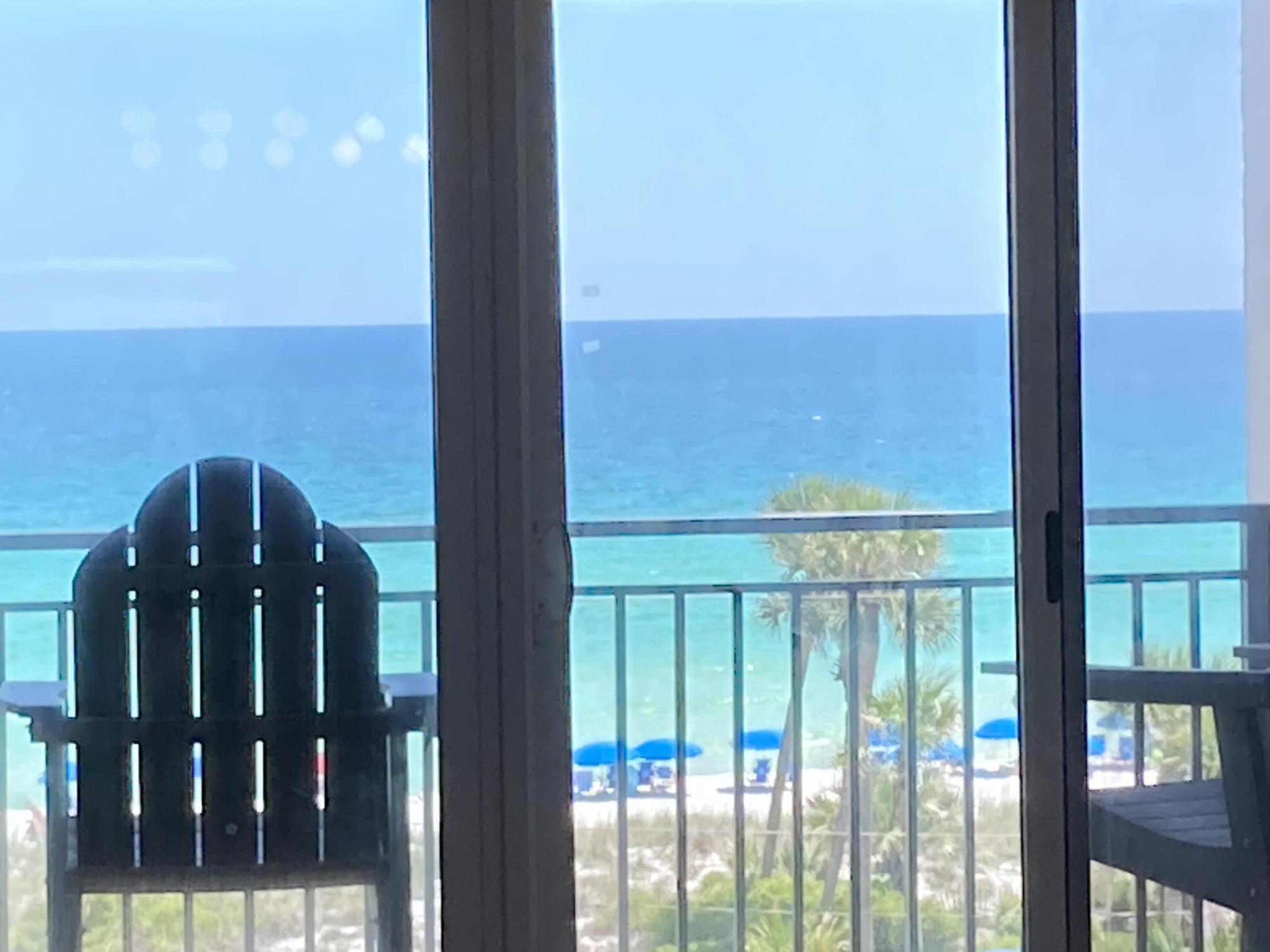 Check out this freshly painted, well maintained 5th floor unit that is beautifully decorated in a beachy vibe and has stunning views of the emerald green waters of the Gulf.  Emerald Isle is located on the white sand beaches of the Emerald Coast of Florida and offers not only the beautiful beach but also a Gulf front pool, BBQ area and a tennis/pickle ball court.  No need to bring your sandy beach equipment up to the unit. Instead, use the convenient storage cage on the ground floor that conveys with the unit. Emerald Isle Condominium recently completed a multimillion-dollar restoration to the building to include repairing concrete, waterproofing and painting the building, elevators, replacing railings and resurfacing the parking lot. Buyer to verify all dimensions and square footage.