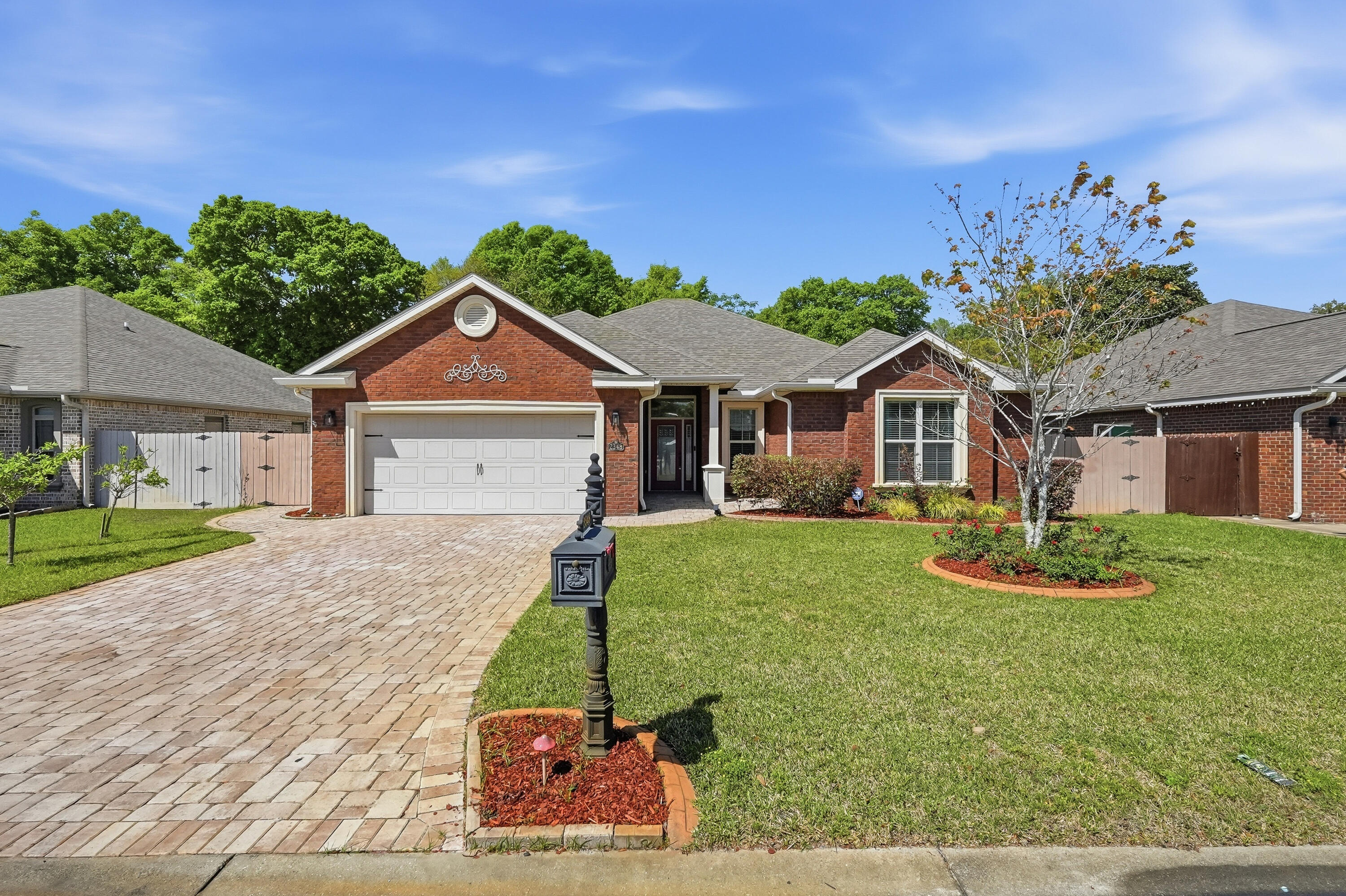 Welcome to this beautifully maintained 4-bedroom, 2-bathroom brick home in the highly desirable Majestic Oaks at Ocean City subdivision in Fort Walton Beach! Perfectly situated just off Racetrack Road, this split floor plan home combines convenience, comfort, and style in one exceptional package. Step inside to discover an inviting open living area highlighted by double tray ceilings, creating a warm and sophisticated atmosphere. The spacious kitchen is a true centerpiece, featuring a raised breakfast bar, granite countertops, custom cabinetry, tiled backsplash and stainless steel appliances. The expansive primary suite is a retreat of its own, complete with double tray ceilings, two walk-in closets, and a luxurious en-suite bath featuring dual vanities, a soaking tub and a walk-in shower. Three additional bedrooms share a well-appointed guest bathroom with a double vanity and granite countertops.
Step outside to enjoy the beautiful screened patio and fully fenced backyard, perfect for relaxing or entertaining. Additional highlights include hardwood flooring throughout and a two-car garage with epoxy flooring. Located adjacent to the County's Stillwell Park, residents enjoy easy access to open green spaces, walking paths, picnic areas, and a basketball court, enhancing the lifestyle this home offers. This is a rare opportunity to own a beautifully upgraded home in a prime location--schedule your showing today!