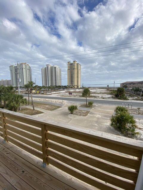 Turnkey Beachside Investment Opportunity - Two Units for the Price of One! Located directly across the street from public beach access in the heart of Navarre Beach, this fully renovated 4BR/3BA coastal retreat offers Gulf views, exceptional flexibility, and outstanding short-term rental potential. Originally designed as two separate units, the property was thoughtfully combined into one spacious residence while still offering the possibility of conversion back to two standalone units for enhanced ROI and rental income. Extensive renovations include a new roof, luxury flooring, updated kitchens and bathrooms, custom shaker cabinetry, dolomite countertops, stainless steel appliances, designer finishes, and a custom staircase. The main residence features 3 bedrooms and 2.5 baths, while the separate studio suite comfortably sleeps four, creating the perfect setup for multi-generational living, owner occupancy with supplemental rental income, or maximizing guest accommodations.
Enjoy beautiful Gulf views from the south-facing balconies and the convenience of being just steps from Navarre Beach's sugar-white sands and emerald waters. With two full kitchens, multiple living spaces, and flexible ownership options, this property is ideal as a primary residence, second home, vacation getaway, or income-producing investment property. Current rental projections exceed $60,000 annually with frequent owner use, while the option to re-establish two independent units is a possibility.