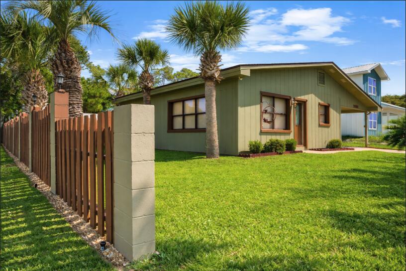Charming Beachside Home in Panama City Beach!

Welcome to this beautiful single-family residence located just a block away from the stunning Panama City Beach! This property features:
2 Bedrooms & 2 Bathrooms: Spacious and well-maintained, perfect for comfortable living. (NO HOA)
1,122 sqft of Living Space: Ample room for your family and guests.7,405 sqft Lot: Enjoy plenty of outdoor space with an UNBELIEVABLY Large fenced in beautiful grass yard perfect for outdoor activities, gardening, or just soaking up the Florida sun.
Updated Kitchen & Bathroom: Modern amenities for a touch of luxury, including stainless steel appliances, beautiful countertops, and elegant tile work.
Extra Flex Room: Can be converted into a 3rd bedroom, home office, or creative studio.