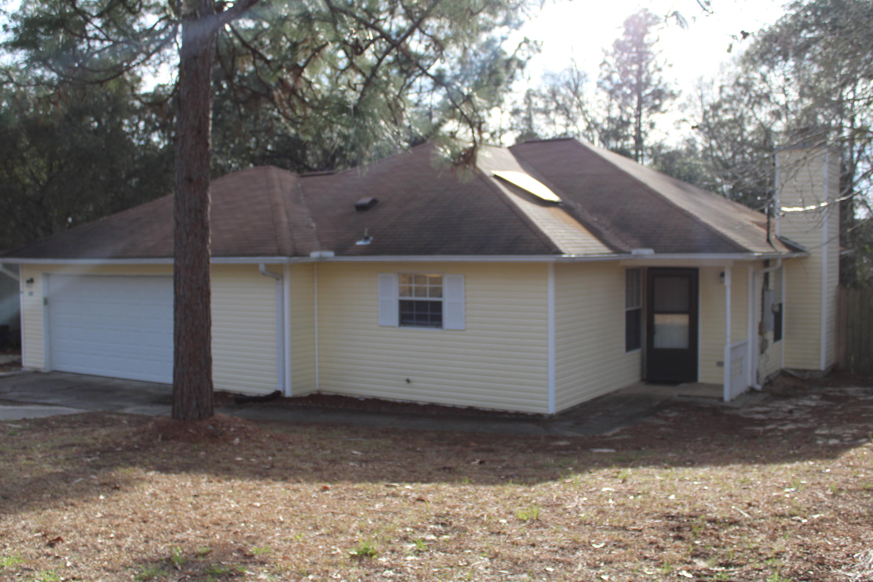 This home features a spacious floor plan with a large family room and a cozy gas fireplace--perfect for relaxing or entertaining. The eat-in kitchen has been updated with newer cabinets, granite countertops, sink, faucet, and appliances, including a stove, dishwasher, and refrigerator. A window over the sink and skylights in both the kitchen and hall bathroom bring in plenty of natural light. The laundry room is located just off the kitchen and leads into a roomy garage with built-in shelving for extra storage.Flooring includes tile in the bathrooms, kitchen, and laundry area, with laminate flooring throughout the rest of the home--including all bedrooms.
Enjoy the large backyard, partially private with no rear neighbors, chain-link fencing, and a storage building. Available April 7.