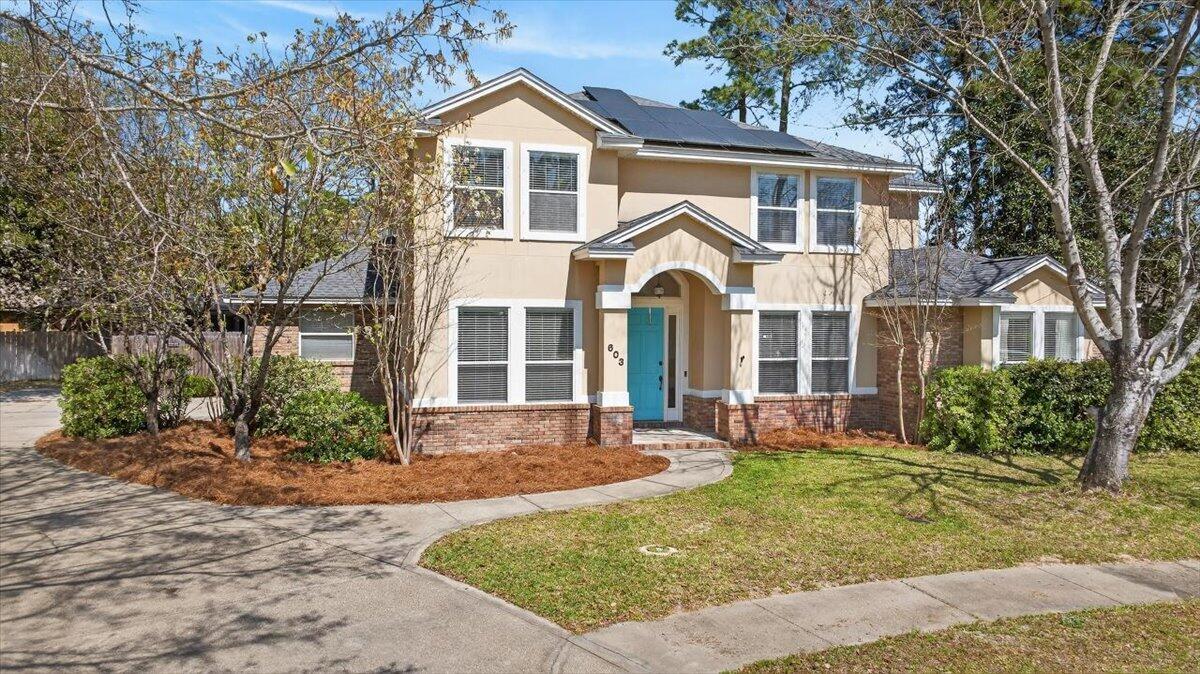 Welcome to a rare find in Niceville! Tucked away on a quiet cul-de-sac, the lot offers more space than you might expect, including a generous side yard that's perfect for pets, play, or simply spreading out. The backyard is designed for enjoying Florida living. A 15x30 gunite saltwater pool sits at the center of a screened outdoor area, with a spacious deck and a covered lanai complete with lighting and fans. There's also a summer kitchen with a gas burner, grill, and refrigerator, making it easy to host family and friends. Tall palm trees and full fencing create a private, relaxed setting. A wired, electric shed could easily serve as a workshop or for extra storage. The yard stays looking great thanks to an automatic sprinkler system. Inside, the home offers six bedrooms plus a dedicated office with double doors and hardwood floors. Just off the front entry is a formal dining room conveniently located near the kitchen. The family room is bright and welcoming with soaring 20-foot ceilings, large windows that bring in natural light, and a gas fireplace framed by built-in shelving. Brand-new LVP flooring runs through the space, and sliding doors lead straight out to the pool and outdoor kitchen. The kitchen has been updated with new GE stainless steel appliances, granite countertops, a touch-activated faucet, and new hardware. There's plenty of cabinet storage, a pantry, a breakfast bar for casual seating, and a breakfast nook with direct access to the outdoor living area. The first-floor owner's suite provides a comfortable retreat with a tray ceiling and soft accent lighting, plus a small nook that works well for a desk or vanity. The ensuite bathroom includes a long double-sink vanity with plenty of drawer storage, a garden whirlpool tub, a large walk-in shower, a private water closet, and a spacious walk-in closet. Also on the first floor is another full bathroom, an additional bedroom, and a large linen closet in the hallway. Upstairs, a winding staircase leads to a landing and walkway that overlooks the family room below. Four additional bedrooms are located here. Each room offers comfortable space and flexibility for guests, hobbies, or family. You'll also appreciate the true laundry room, thoughtfully designed so you don't have to pass through it to reach the garage. It includes cabinets above and below the counter, as well as a utility sink. The garage offers extra ceiling height, additional storage space, and a door that leads directly to the backyard. With solar panels to help keep energy costs down, thoughtful updates, and inviting indoor and outdoor living spaces, this home offers comfort, space, and a setting that's ready to enjoy. And for further peace of mind, the Seller will provide a fully transferable home warranty, as well as a $10k concession to Buyers to cover carpet replacement, painting, or some closing costs.