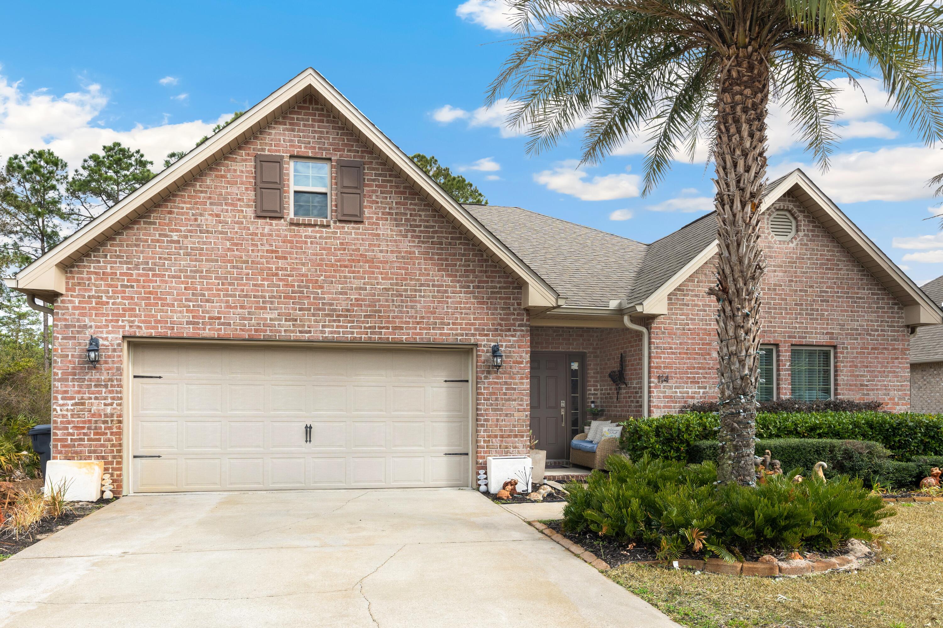 Welcome home to 114 Maddox Street in the highly sought-after Peach Creek community - where luxury finishes, thoughtful design, and relaxed coastal living all come together. This beautifully maintained, single-story home offers 3 spacious bedrooms, 2 bathrooms, and approximately 1,886 sq. ft., plus the additional heated and cooled space compliments to the AC-installed in the garage. From the moment you step into the large, welcoming foyer, you'll feel the sense of openness and quality that flows throughout the home. The open-concept living area features elegant tray ceilings that add volume and sophistication, while tile flooring runs seamlessly through every room - no carpet anywhere - for a clean, modern look and easy maintenance. The kitchen is a true centerpiece, boasting crisp white cabinetry, granite countertops, and a functional layout that makes everyday living and entertaining feel effortless. Just off the main living spaces, the screened-in back porch and extended lanai create a relaxing indoor-outdoor retreat, perfect for morning coffee, evening cocktails, or simply escaping the summer sun in comfort.

The primary suite is a private sanctuary, highlighted by tray ceilings and an en suite bathroom designed for luxury and convenience. Enjoy dual sinks in the vanity, a stand-up shower, and a separate soaking tub that invites you to unwind at the end of the day. With its thoughtful layout and upgraded finishes, this home is truly move-in ready and styled for modern living.

Located in the family-friendly Peach Creek community, 114 Maddox Street offers the best of both tranquility and convenience. You're just a short drive from the vibrant 30A lifestyle, beautiful beaches, schools, and premier shopping and dining. If you're looking for a stylish, low-maintenance home with a luxurious feel and inviting indoor-outdoor living, this Peach Creek gem is a must-see!