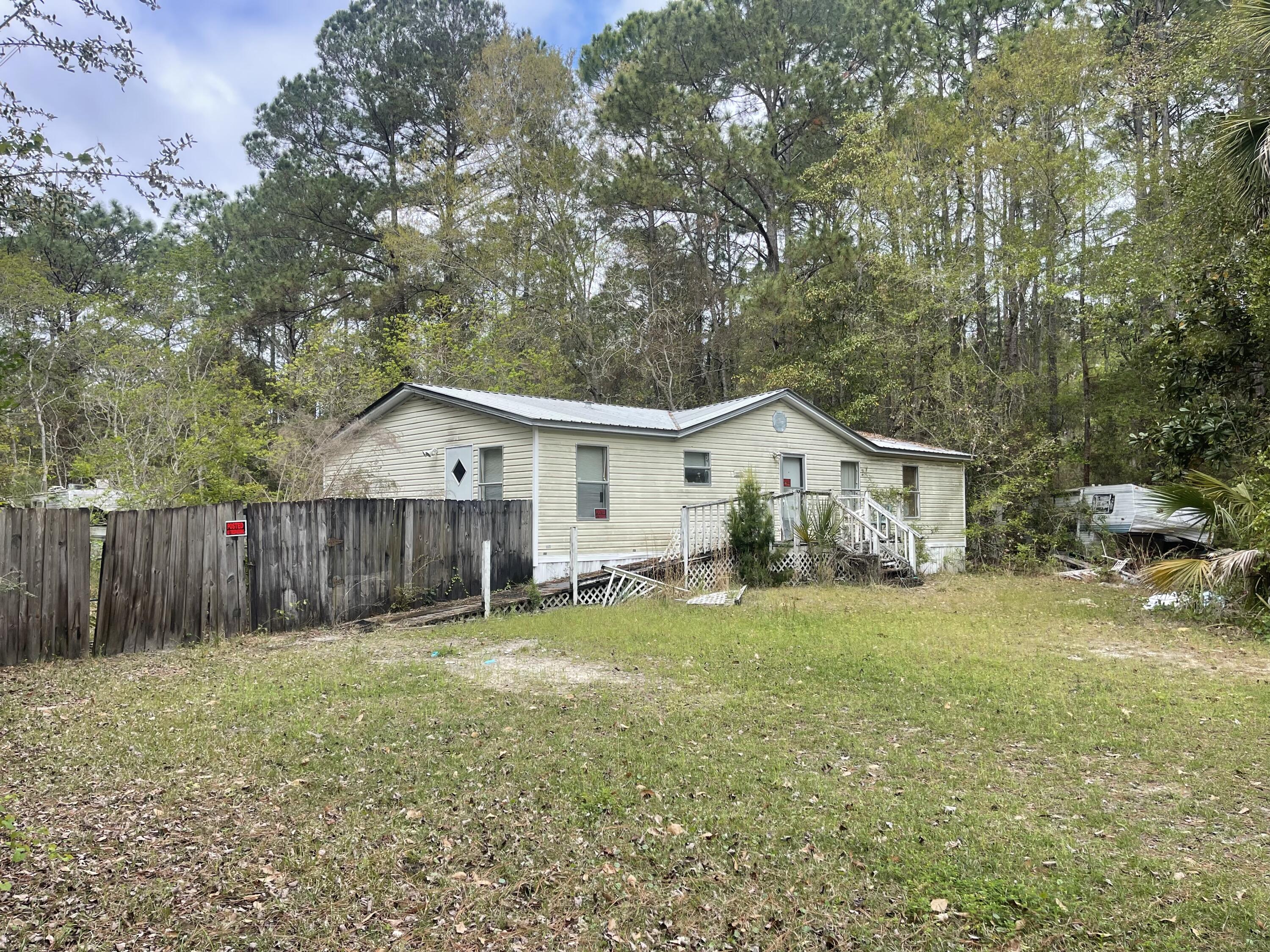 Opportunity awaits at 93 Laird Dr in Freeport! Situated on a generous .42 acre homesite, this property offers an opportunity for anyone looking for their next project. The home is being sold AS IS and is in need of repairs, making it ideal for renovation or potential replacement.
 There is a Detached Garage with Carport over cement slab and also a stand alone Shed.
With Freeport's expanding amenities including the Choctawhatchee Bay, and the beautiful beaches of the Emerald Coast, this property holds strong potential for the right buyer willing to bring it back to life. The front yard has a privacy fence on the left. The back yard has a chain link fence. HVAC was working in 2025. Electricity has been terminated and will not be turned on for inspections. Flooring and Bathrooms are in need of updating. There is trash/items of no value around the home and two RVs both  considered to have $0 value. Bonus!: The adjoining Lot (wooded) to the West is also available for purchase. See separate listing under land.
THIS SALE IS AS IS; No Repairs. No Clean Up. The boat, boat trailer and truck do not convey.
THIS IS A CASH-ONLY SALE; no financing options available. Showings by appointment ONLY. 
Seller has never occupied the property and has no disclosures or knowledge of its past or current condition. Seller is making no claims or warranties of such property. It is the sole responsibility of the buyer to inspect the property to determine its condition.