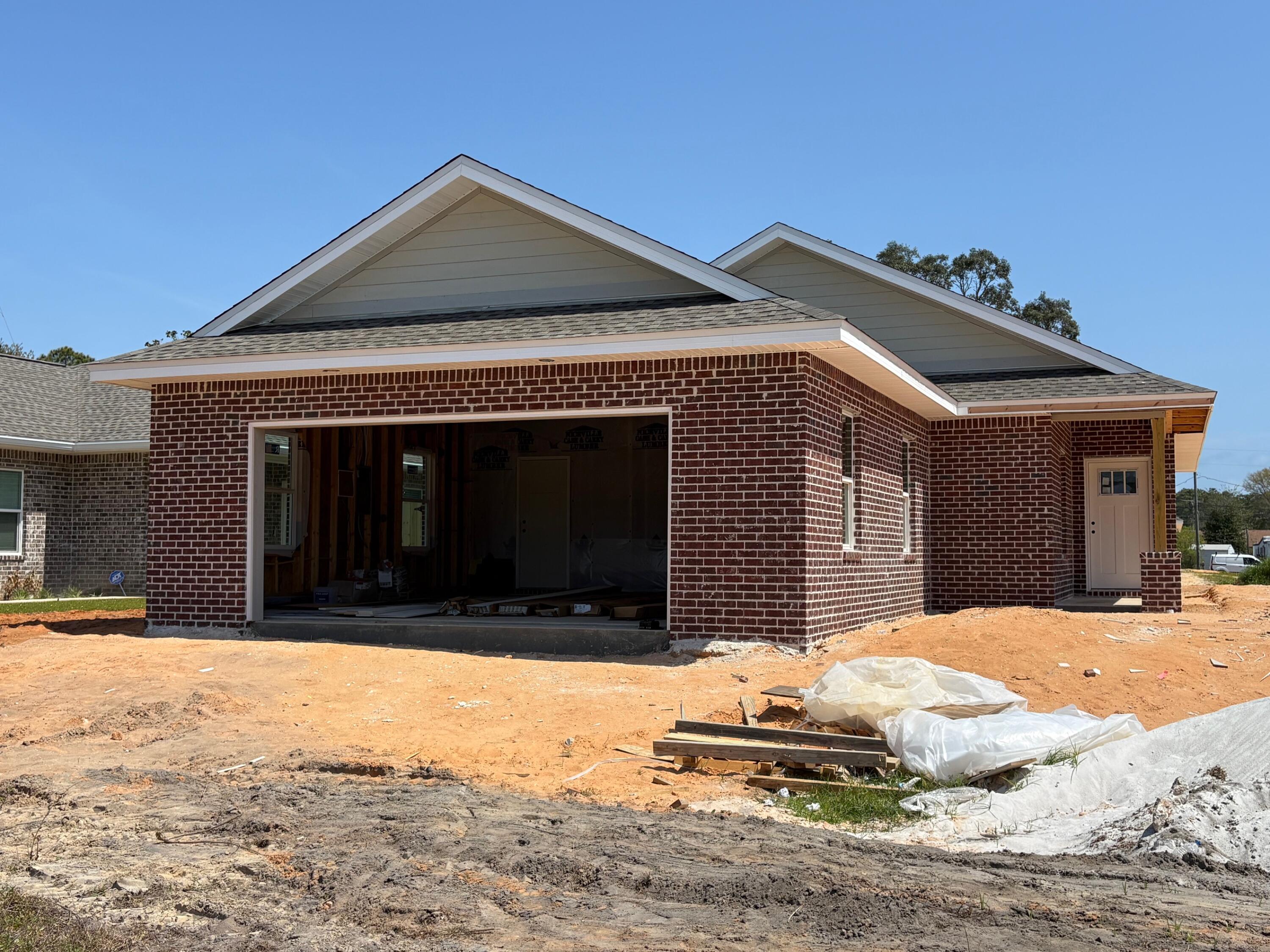 NEW CONSTRUCTION HOME just in time for summer (June)!! NOTE: Finished photos are of a previous build, home is currently under construction. This home is being built by Hi Lite Homes in Villa Tasso, one of the fastest growing communities in the Niceville area!!  This adorable and AFFORDABLE 3 bedroom, 2 bath brick home with a 2-car garage  features an open, split bedroom floorplan that is sure to please all buyers. The fully sodded and irrigated yard is just the perfect size AND it backs up to an alleyway providing access into the back yard for convenience. Interior features include shaker style cabinets, granite counters, stainless appliances, LVP flooring and even blinds for the windows. The home is located on quiet street where 7 additional new homes will be built on the same block. Homes in this price range go fast so don't miss your opportunity to make this NEW home your own!