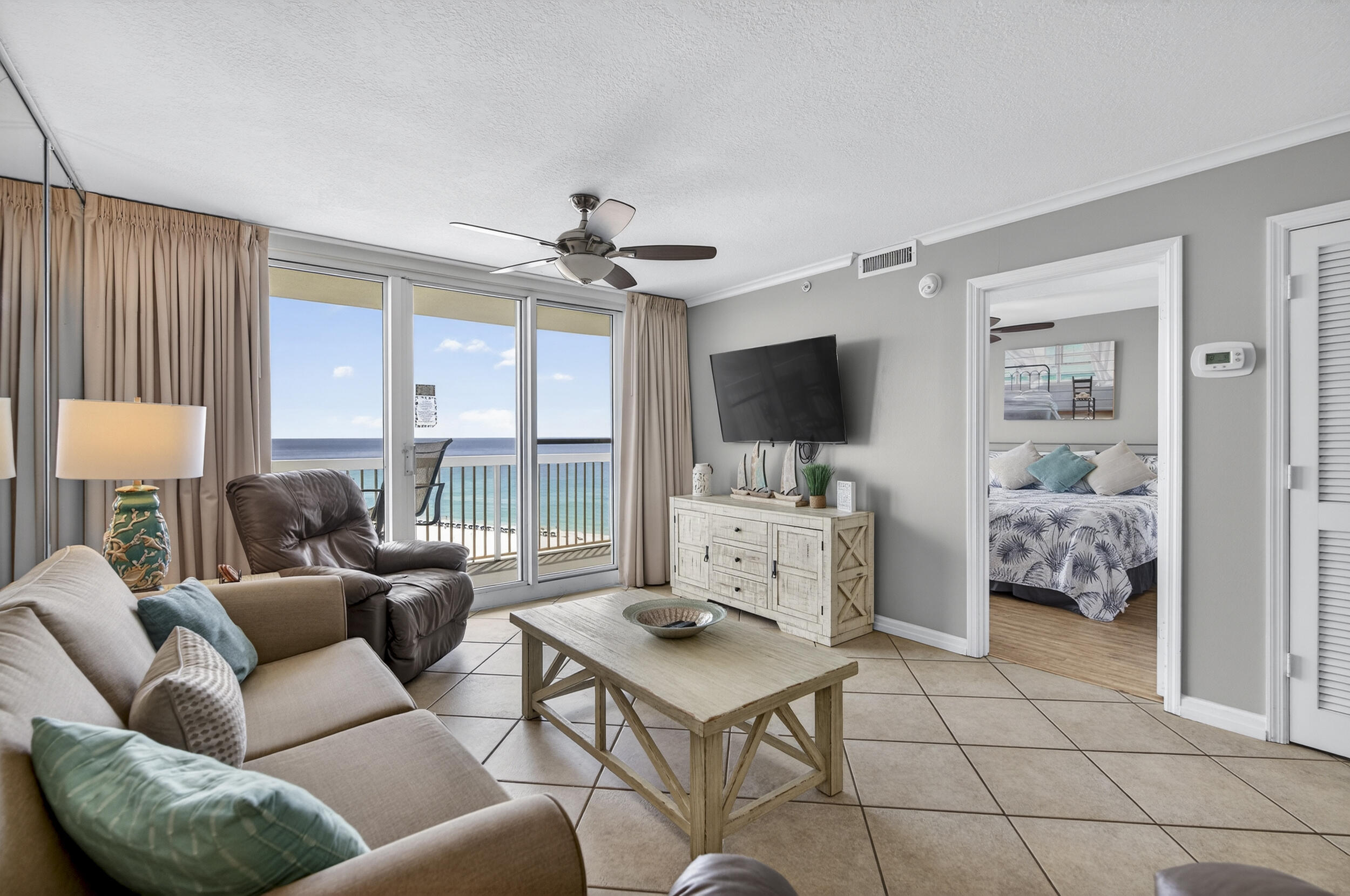 Beautiful 2-bedroom Gulf-front condo in the highly desirable Pelican Beach Resort! This condo is nicely decorated with the beach in mind.  It is turnkey ready and offers tile flooring throughout--no carpet--along with plantation shutters and custom drapes that add style and sophistication. The bathrooms have been upgraded with modern finishes. Saving the best to last - the private oversized balcony offers incredible views of the Gulf and sugar-white beaches and is accessible from both living room and primary bedroom. Pelican Beach Resort amenities include direct beach access, multiple beachfront pools (including indoor/outdoor options), hot tubs, indoor sauna & steam room, a fitness center, tennis courts, pickleball, on-site café and tiki bar, game room, covered parking and security gate making it a favorite for both owners and vacation renters. Ideal as a second home or income-producing rental, this condo combines coastal charm, upgrades, and resort-style living in the heart of Destin!