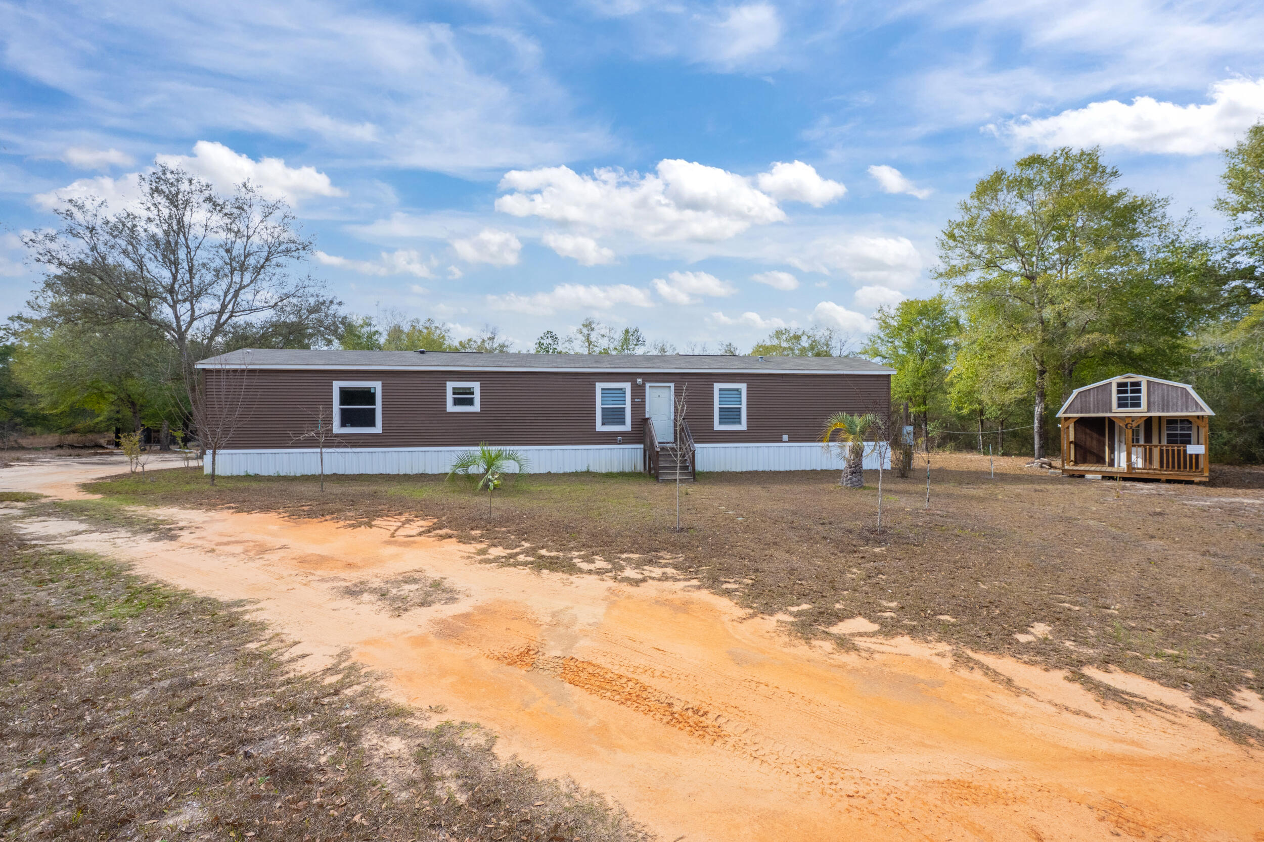 Charming home located on 1.39 acres. Walking in to this home you will be taken aback by the gorges look and open feel. The kitchen features newer color matched appliances and kitchen island. The kitchen also features a vent hood that gives this home a certain class and elegance not usually found in this price range. The large master bedroom opens into an ensuite that has a very large soaker tub, separate shower and walk-in-closet. BUT the outside is where it really begins. There is a 12x36 building that has power and insulation. There is also a 15x20 screened building that was previously used as a grilling/smoker outdoor kitchen. This home also has an outdoor prep area. This area is great for preparing any type of food. This can range from fish cleaning to any sort of meat processing.