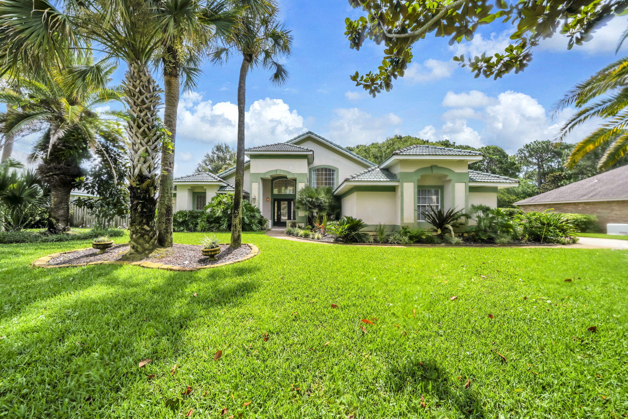 Opportunity awaits in the highly sought-after Golf Community of Indian Bayou! This spacious 3-Bedroom, 3- Bathroom pool home offers 2,312 square feet of Single-Level living on a private 0.33-acre lot backing to natural green space.

To make this opportunity even more attractive, the seller is Offering Significant Improvements with an acceptable offer, including a NEW Dimensional Shingle Roof, Pool Resurfacing, & repair of damaged Window Glass & Seals. This represents approximately $70,000 in VALUE to be completed prior to closing for added peace of mind. Bring your vision and personal touches to transform this home into your dream property.

Inside, the open-concept floor plan features multiple living & entertaining spaces with tile & luxury vinyl plank flooring throughout the common spaces. Upon entry, you'll find a formal living room & separate dining room connected by a convenient wet bar, creating the perfect setting for holiday gatherings, dinner parties, or hosting family & friends. The chef's kitchen is designed for entertaining or gathering with family with expansive granite countertops, bar seating, abundant cabinetry, a separate pantry, gas range, & stainless-steel appliances including an oversized French-door refrigerator, dishwasher, and microwave.

The main living areas boast soaring 18-foot ceilings, & a cozy gas fireplace, creating an impressive yet inviting atmosphere. Natural light pours through the home's many windows and sliding glass doors, (READ MORE) seamlessly blending indoor and outdoor living. Multiple sliding glass doors lead to the covered patio, which is already plumbed with natural gas for a future grill or outdoor kitchen--ideal for enjoying warm Florida evenings and weekend cookouts by the pool.

Step outside to a fenced backyard that backs to undeveloped natural green space, providing exceptional privacy and a peaceful backdrop rarely found this close to the heart of Destin. The freeform gunite pool with water feature offers the perfect foundation for creating your own outdoor oasis where you can spend afternoons soaking up the Florida sunshine, entertaining guests, or unwinding after a day at the beach or golf course.

The split-bedroom floor plan provides privacy for owners and guests alike. The oversized primary suite offers ample room for a sitting area, reading nook, home office, or hobby space. The en-suite bath features dual vanities, a large walk-in closet, jetted soaking tub, separate walk-in shower, and private water closet--creating a relaxing retreat. Two additional guest bedrooms are served by two full guest bathrooms, providing comfortable accommodations for family and friends.

Additional features include an interior laundry room, extra-wide side-entry garage with pull-down attic storage access, oversized driveway, and double gates providing convenient backyard access and storage space for watercraft or additional vehicles. Whether you enjoy boating, paddleboarding, fishing, or simply taking advantage of all that the Emerald Coast has to offer, this property provides the flexibility to support your lifestyle.

Located in one of Destin's most desirable golf communities, residents enjoy a central location close to shopping, dining, entertainment, and outdoor recreation. Spend mornings on the golf course, afternoons at the beach, and evenings enjoying Destin's renowned waterfront restaurants and coastal sunsets. Just minutes from Indian Bayou's executive 18-hole golf courses and only 2.3 miles from the sugar-white sands of the Gulf of Mexico and Henderson Beach State Park, this home offers the perfect blend of privacy, recreation, and the coveted Destin lifestyle. Eligible for VA and conventional financing. Don't wait, Call your Realtor today to schedule a showing or virtual tour!