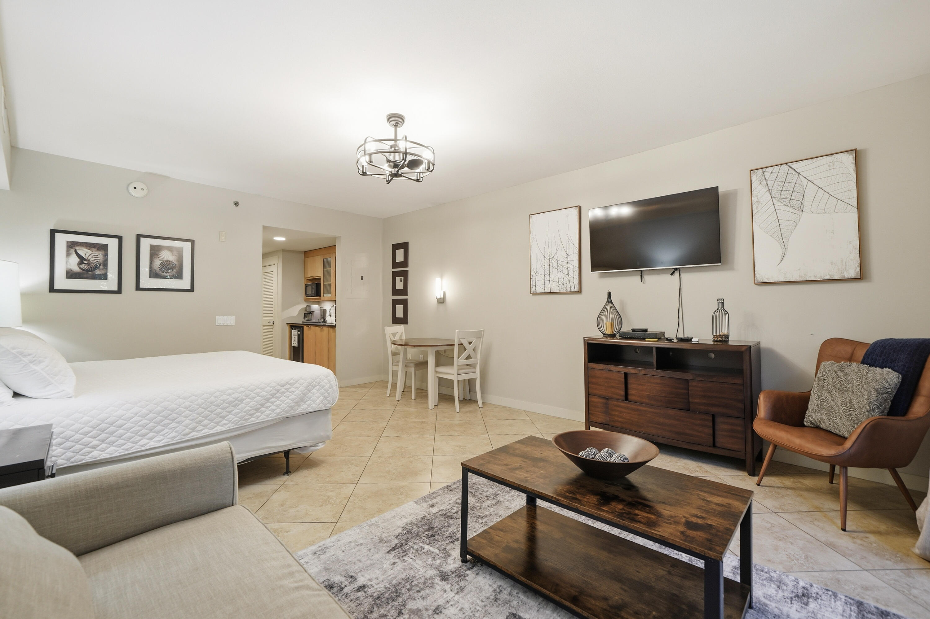 Welcome to ''High Tide,'' a beautifully furnished second-floor studio condo in Bahia at Sandestin Golf and Beach Resort. Offering proven appeal as a vacation home, investment property, or personal coastal retreat, this turnkey residence combines an exceptional location with outstanding resort amenities just steps from the Village of Baytowne Wharf.
This thoughtfully designed 500-square-foot studio features luxury vinyl plank flooring throughout, fresh interior paint, stylish furnishings, and a bright, open layout designed for easy, low-maintenance living. The breakfast kitchenette is equipped with both a Keurig and traditional coffeemaker, while the spacious full bathroom includes a tub/shower combination and an updated vanity with additional storage.
The inviting living and sleeping area comfortably accommodates up to four guests with a king-size bed and queen sleeper sofa. A mounted 50-inch Smart TV creates the perfect space to relax, and the private Juliet balcony overlooks the resort-style pool, spa, and beautifully landscaped grounds, providing a peaceful setting to enjoy your morning coffee or unwind after a day exploring the Emerald Coast. Bahia owners enjoy exclusive access to the private Solstice Club on the Bay, offering an additional waterfront gathering space with breathtaking bay views.  Located within Sandestin Golf and Beach Resort, residents and guests enjoy access to championship golf courses, a world-class tennis center, a full-service marina, resort swimming pools, walking and biking paths, seasonal tram service throughout the resort, and convenient beach access. Just outside your door, the Village of Baytowne Wharf offers waterfront dining, boutique shopping, live entertainment, festivals, and year-round events.
Whether you're searching for a turnkey vacation rental, investment property, second home, or weekend getaway, this beautifully updated Bahia studio offers an exceptional opportunity to enjoy one of the Emerald Coast's premier resort destinations.