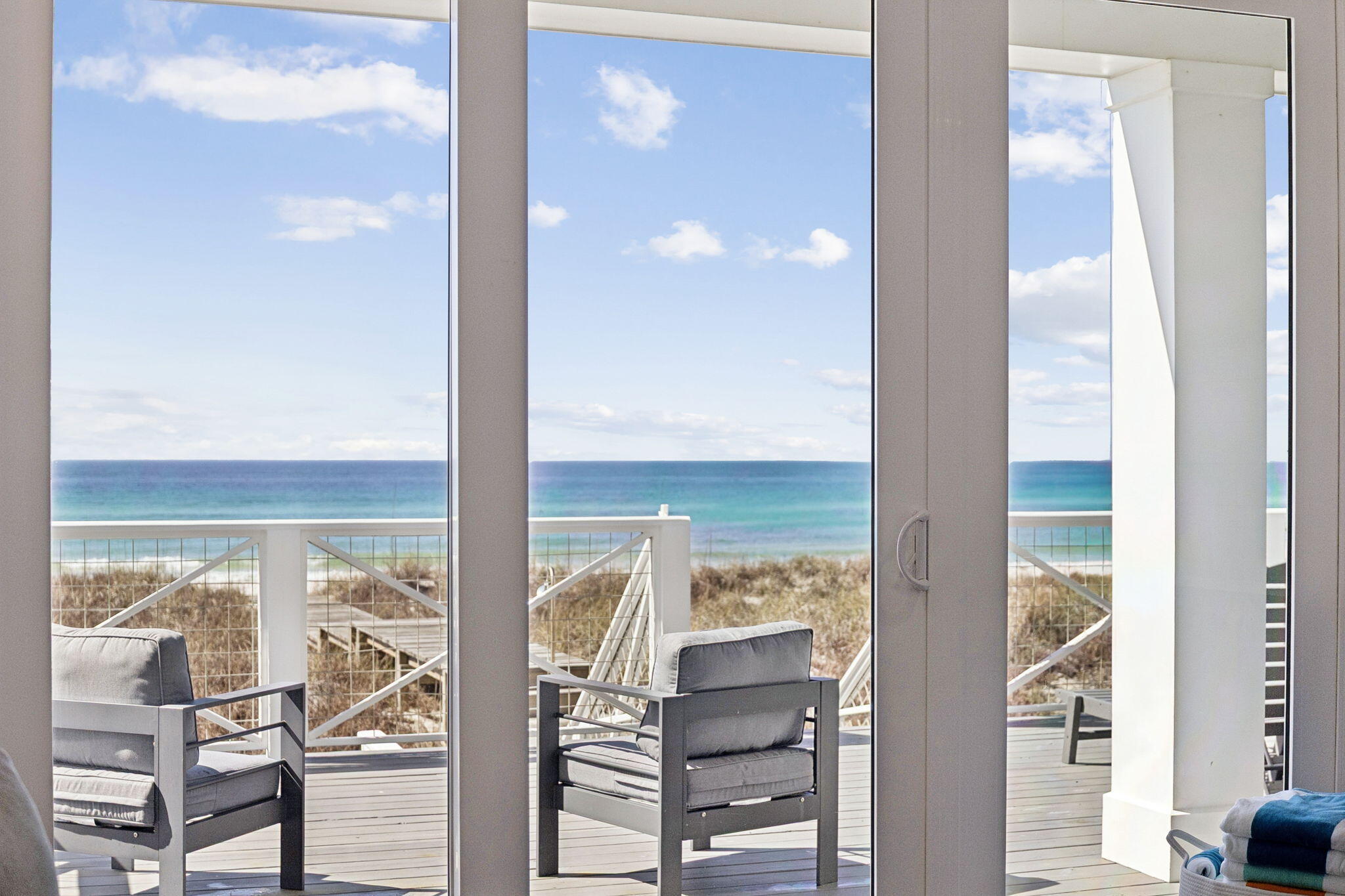 Wake up to uninterrupted Gulf of Mexico views, step onto your private balcony, and hear nothing but waves. 16525 Front Beach Road is a fully furnished, turnkey beachfront home offering 50 feet of pristine Gulf frontage, its own beach walkover right out the back door over the dune, a heated pool, and rental projections of $359,000 annually with accommodations for up to 22 guests. Whether you're seeking a high-performing vacation rental on the Emerald Coast or a legacy Gulf front family retreat, this property delivers on every level.
Maintained in like-new condition and offered fully furnished, this Gulf front home is move-in ready. With strong rental projections and capacity for large groups, it presents a compelling opportunity for investors seeking a premier beachfront vacation rental on the Emerald Coast. Designed to maximize Gulf views, the home features three expansive balconies connected by a spiral staircase, creating multiple outdoor living spaces with panoramic water views. Two Gulf-facing primary bedrooms open directly to their own balconies, letting guests wake up to the sound of waves and unobstructed views of the Gulf of Mexico.
The second floor serves as the main living level, where an open-concept kitchen, dining, and living area flows seamlessly to a large balcony overlooking the beach. The kitchen is built for entertaining, featuring quartz countertops, custom cabinetry, a tile backsplash, a large island with seating for six, gas range, built-in ice maker, and double sinks.
The first floor is designed for gathering and recreation, with a bunk room and recreation room that opens directly to the heated pool area. A built-in bar with ice maker and beverage refrigerator creates the perfect setup for poolside entertaining after a day on the beach.
The primary suite offers Gulf views, a balcony, walk-in closet, double vanity, garden tub, and separate shower. Throughout the home you'll find shiplap accent walls, ensuite bathrooms in every bedroom, generous owner storage closets on each floor, and integrated WiFi extenders with indoor and outdoor speakers.
Outside, a beach walkover, outdoor shower, Polywood outdoor furniture, and abundant parking round out a package that is rarely found in Gulf front homes. Positioned on a quiet stretch of beach with no nearby public walkovers, the shoreline here stays uncrowded, giving guests the feel of a private beach just steps from the door, while still being just minutes from Pier Park's restaurants, shopping, and entertainment.
16525 Front Beach Road is a rare Gulf front home where luxury amenities, an unbeatable location, and exceptional vacation rental income potential come together in one standout beachfront property.