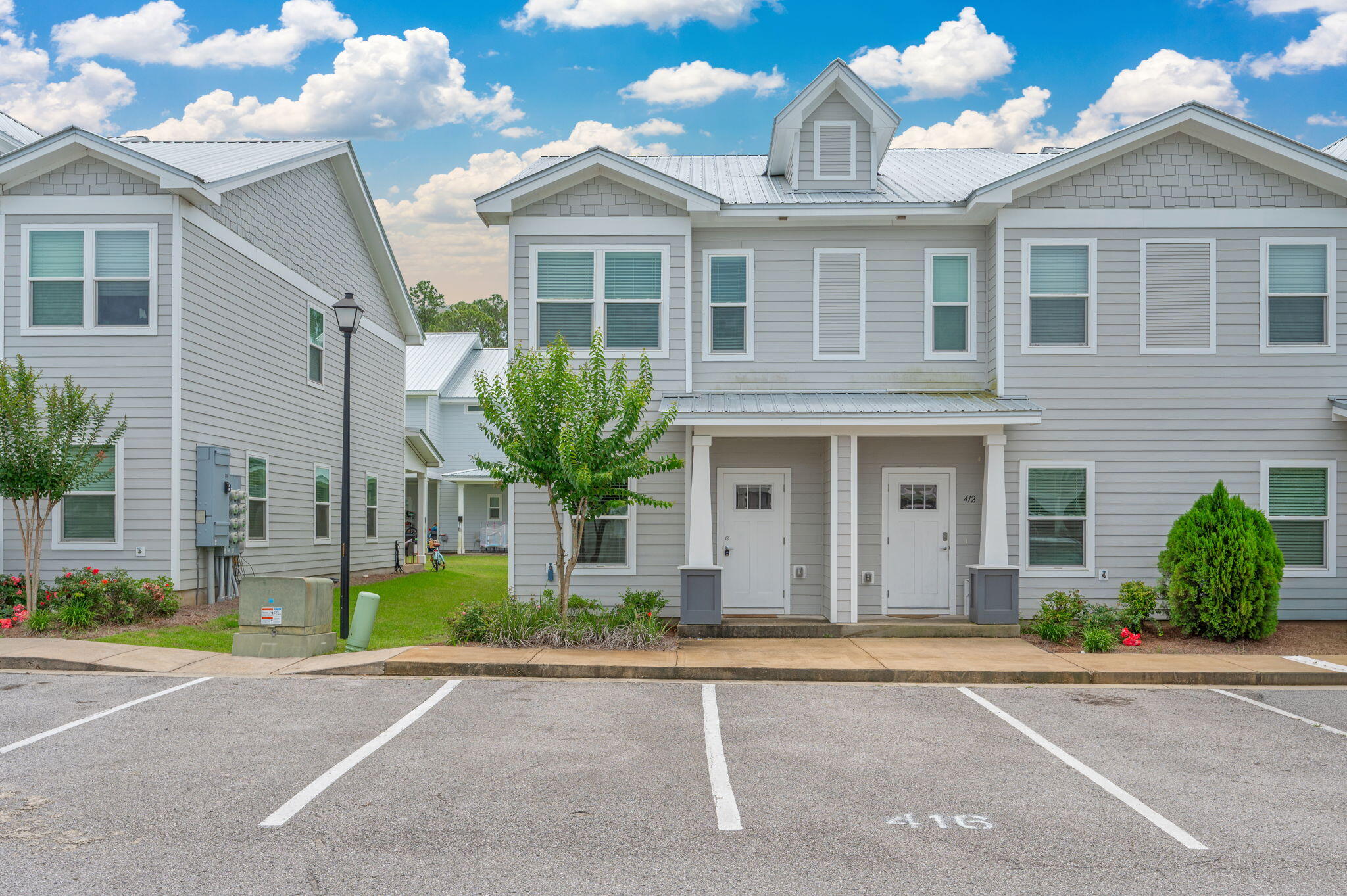 Welcome to 416 Date Palm Lane, a beautifully maintained end-unit townhome in the desirable Verandas at Freeport community. Offering added privacy and abundant natural light, this move-in-ready home features an open-concept layout with luxury vinyl plank flooring on the first floor, plush carpeting upstairs, and quartz countertops, stainless-steel appliances, and modern finishes throughout. Upstairs, you'll find three bedrooms, including a spacious primary suite with a walk-in closet and private bath. Enjoy relaxing on the covered back porch and the convenience of low-maintenance living. Community amenities include a pool, pickleball courts, playground, and basketball court. Conveniently located near schools, shopping, dining, Choctawhatchee Bay, and the white-sand beaches of the Emerald Coast, this home is ideal as a primary residence, vacation getaway, or investment property.