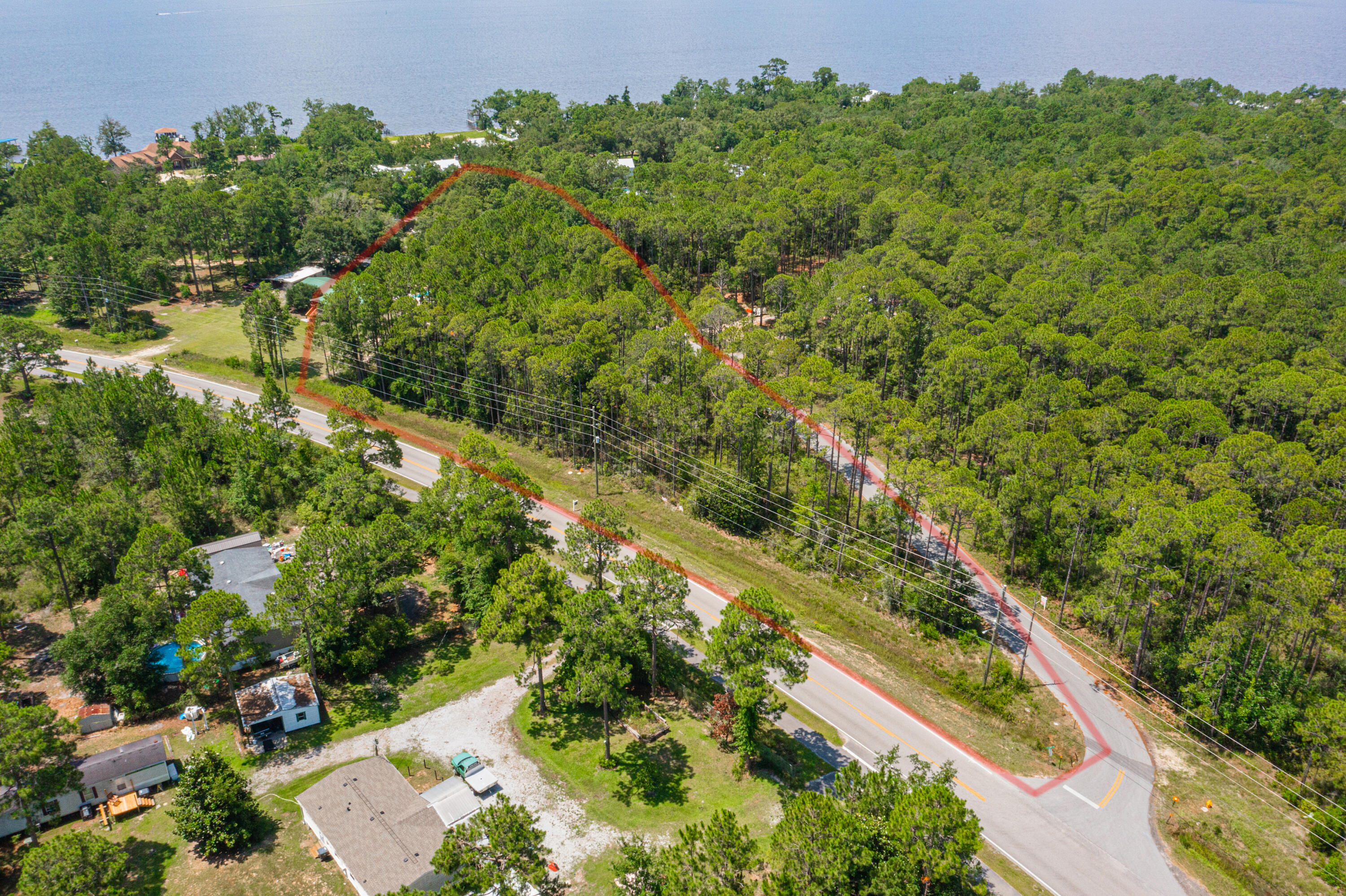 Less than a mile to Choctawhatchee Bay and sitting in Flood Zone X -- this one-acre wooded lot in Freeport checks every box. Build your fishing camp, vacation getaway, or permanent home on a full acre of mature, tree-covered land with NO HOA and no restrictions on your timeline or vision. Flood Zone X means no flood insurance requirement -- a significant cost savings that's increasingly rare at this proximity to the bay. Anglers, outdoor enthusiasts, and anyone craving that true Panhandle lifestyle will immediately recognize what this lot represents. Walton County land this close to the water, this affordable to insure, and this free of HOA control doesn't come around often. Come see it before someone else does.