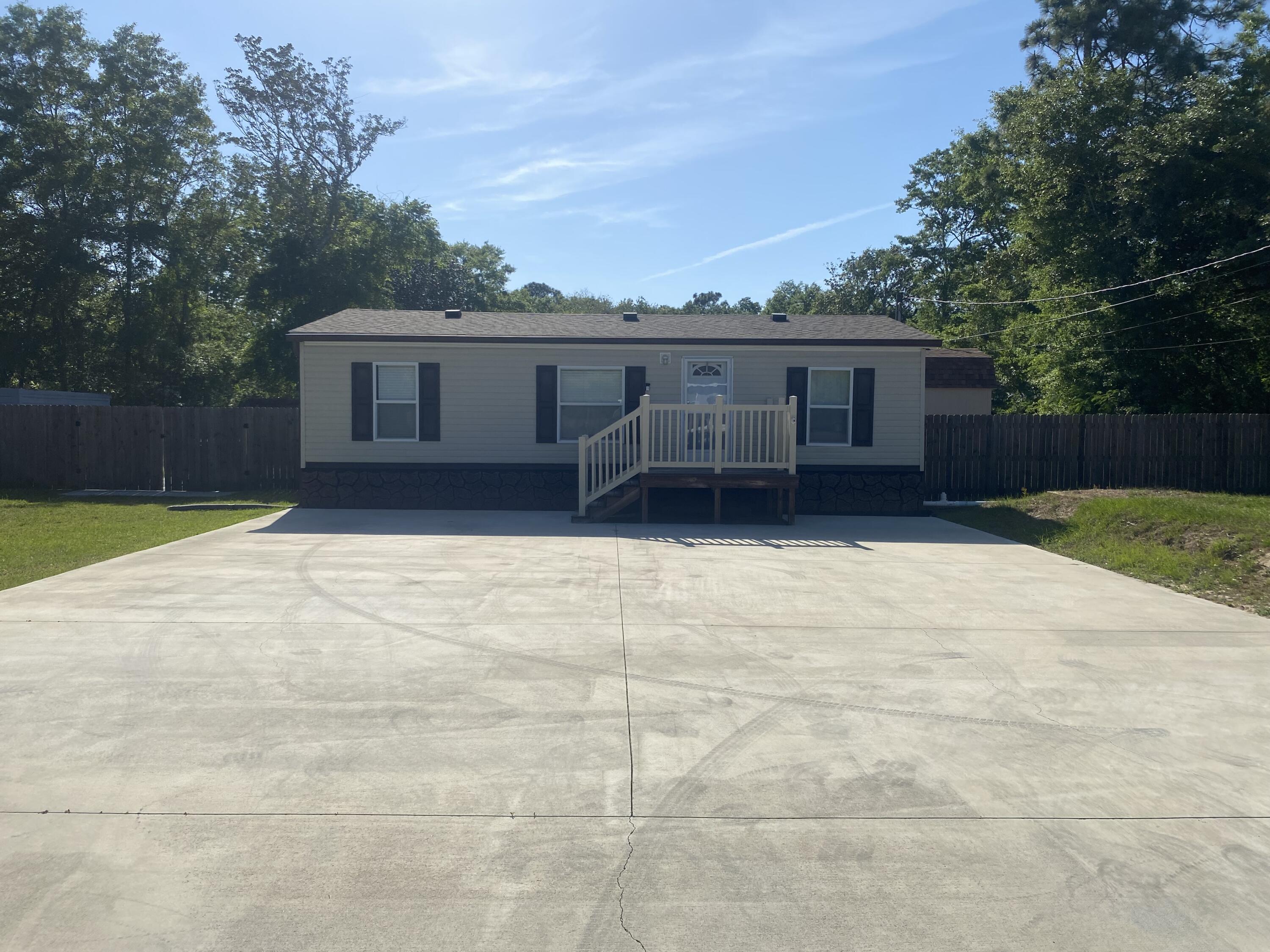 Charming Double Wide for rent in Navarre Beach! Enjoy coastal living in this well-maintained 2-bedroom, 2-bath home just minutes from the water. This layout, is perfect for relaxing or entertaining. Step outside onto the inviting deck--ideal for morning coffee or evening gatherings. The property includes a fully fenced yard for privacy, a durable concrete driveway, and not one but two sheds--plenty of space for storage, hobbies, or a workshop. If you're looking for a primary residence to rent,  this home offers comfort, convenience, and that laid-back beach lifestyle. Sorry No Pets. Credit Score of 640 required.
Don't miss out! Call Navarre Beach Realty Inc. to see
 850-936-0700.
