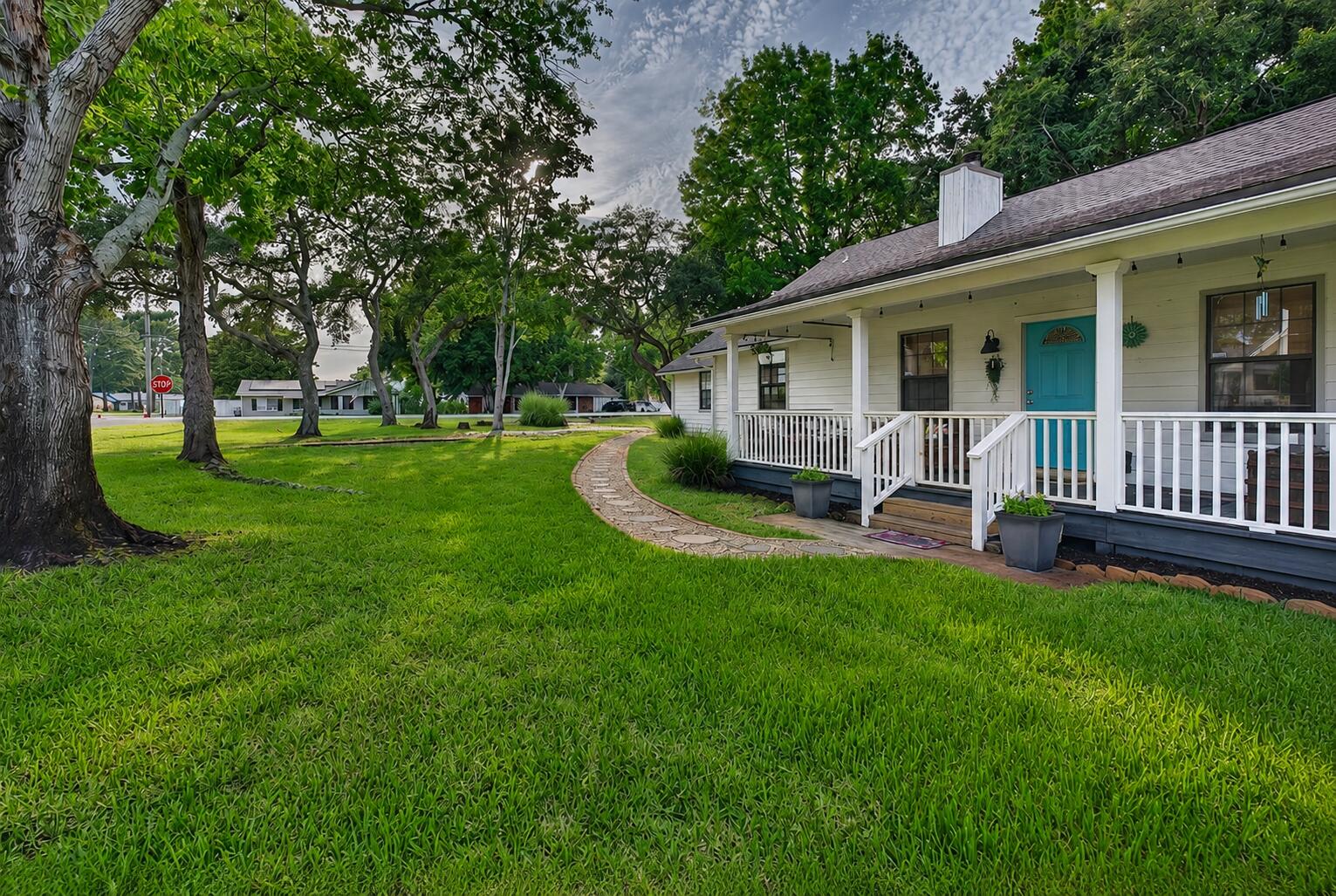 Don't miss this beautifully updated Smart Home with Florida Cottage charm in desirable Kell-Aire Gardens. NO HOA!  This open-concept floor plan is designed for comfortable living and effortless entertaining.The spacious living area showcases soaring vaulted ceilings, luxury vinyl plank flooring, a striking shiplap accent wall with wood shelving, and a cozy wood-burning fireplace, creating the perfect gathering space for those occasional cool Florida evenings. The tastefully renovated interior offers numerous upgrades, including slab granite countertops, updated kitchen appliances, a charming bay window, brick and shiplap accents through out, updated Master bath and beautifully refreshed bathrooms. Smart home features include a Honeywell Smart Thermostat and exterior lighting that can be conveniently controlled from your phone. Step outside and enjoy exceptional outdoor living with a spacious 300-square-foot back deck, an expansive covered front porch complete with a cozy porch swing for your morning coffee and chats with your friendly new neighbors. A fenced backyard features a fire pit, mature citrus tree that produces (orange, lemon, and lime) and pineapple plants creating your own private Florida oasis. Situated on a quarter-acre lot, there's plenty of room to relax, garden and entertain. The extended driveway and walkway enhance curb appeal while providing ample parking, complemented by a two-car garage with ample storage above. Residents of Kell-Aire Gardens enjoy access to the Kell-Aire Nature Walk, a 3-acre neighborhood park featuring, nature trail, playground, swings, benches, and open green space. Convenient location in the heart of Destin, close to shopping, schools, dining and entertainment, just minutes from the Emerald Coast's white-sand beaches, this charming Florida cottage-inspired home offers the perfect blend of comfort, convenience, and coastal living.