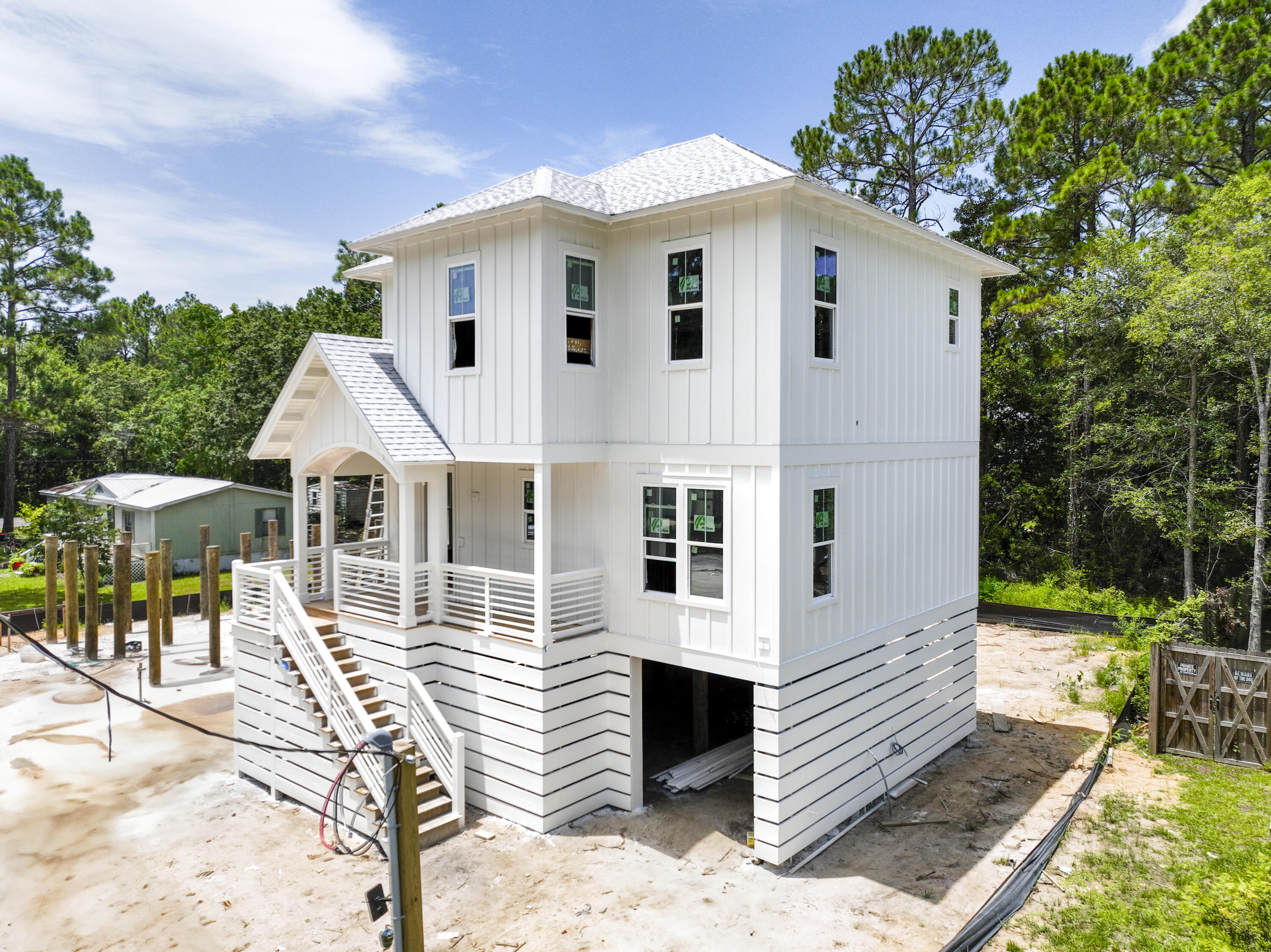 Discover coastal living in this custom-designed home in the desirable Santa Rosa Beach. Featuring approximately 1,726 heated and cooled square feet, this thoughtfully designed residence offers soaring ceilings, an open-concept floor plan, spacious living areas, a large kitchen island, and generous front and rear porches--perfect for relaxing or entertaining.

Enjoy an unbeatable location just minutes from two public boat ramps with easy access to Choctawhatchee Bay. The Gulf is just as convenient, with public beach access only one turn and a straight shot away. Whether you're searching for a primary residence, vacation getaway, or investment property, this home offers quality craftsmanship, modern coastal living, and easy access to the best of Santa Rosa Beach.