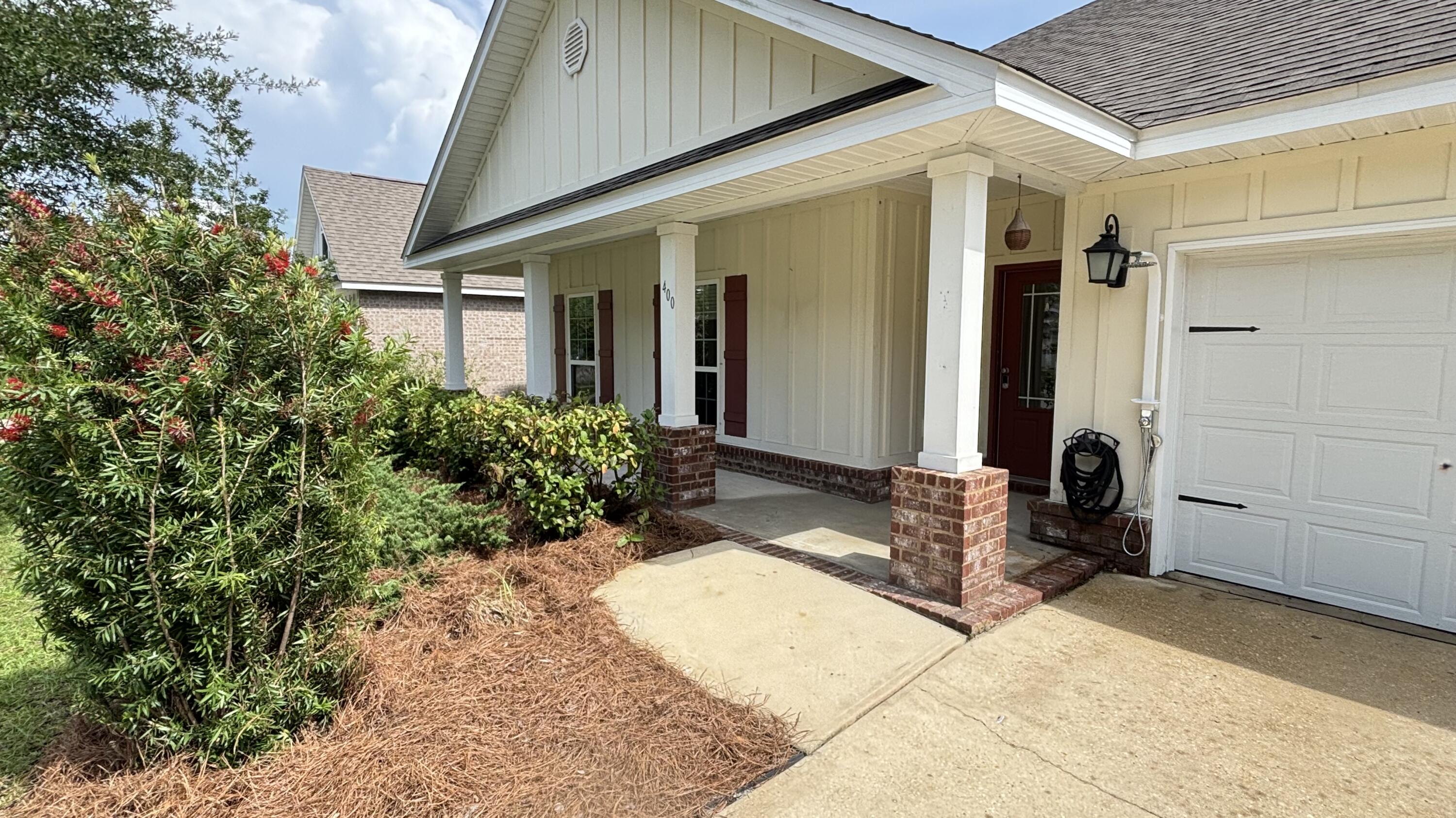 $5k CREDIT TO BUYER AT CLOSING w/acceptable offer. Welcome to 400 Lilly Bell, a spacious, move-in ready home in the highly sought-after Hammock Bay community. This residence features granite countertops in the kitchen and all baths, stainless steel appliances (Ref, MV, range, and DW), and a large luxury primary bath for added comfort. Crown molding and shiplap accents in the entry, family room, and primary bedroom create a warm, custom feel, while hardwood floors in all common areas and tile in the baths and utility room offer both style and durability. Outside, enjoy a fully fenced backyard, full irrigation system, rear gutters, gas hot water heater, gas stub-outs, and an attached two-car garage. Seller is motivated--bring all offers! Living in Hammock Bay means resort-style amenities right at your doorstep. Residents enjoy multiple resort-style pools, a fitness center with 24/7 style access, tennis, pickleball, and basketball courts, plus scenic sidewalks and trails for walking and biking. The nearby Freeport Regional Sports Complex offers on-site baseball, softball, football, and soccer fields, along with additional courts and walking paths for active families. Hammock Bay's vibrant Town Center hosts regular community events, outdoor movies on the big screen, food and drinks at local spots, and a popular monthly farmers market, so there is always something to do close to home. Live the Gulf Coast lifestyle in one of Freeport's premier master-planned communities.