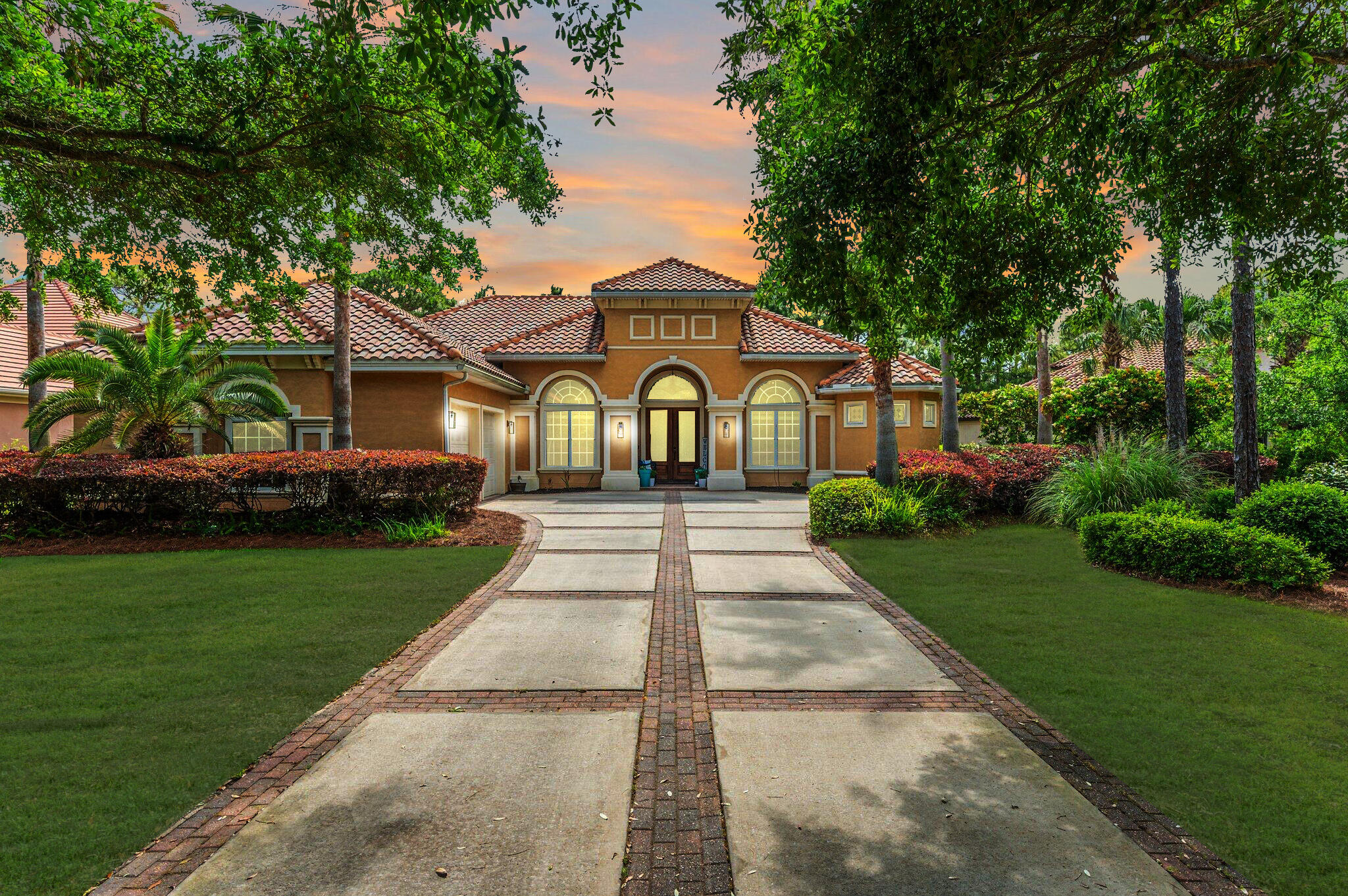 Experience refined, single-level living in the gated golf community of Regatta Bay. This 5-bedroom lakefront home offers spacious gathering areas and private retreats, including two home offices and a formal living room. Enjoy seamless indoor-outdoor living with a screened lanai overlooking the lake and accessible from multiple rooms. The chef's kitchen features granite countertops, stainless steel appliances, gas cooktop, wine refrigerator, warming drawer, breakfast bar, and center island. The primary suite is a peaceful escape with lake views, private office, dual closets, and a spa-like bath with soaking tub and walk-in shower. As a part of the Regatta Bay community, this home offers more than just a place to live, it delivers a lifestyle. Regatta Bay is a gated, master-planned neighborhood known for its beautifully maintained grounds, top-tier amenities, and unbeatable central Destin location. Residents enjoy access to a championship golf course, resort-style pool, tennis courts, walking trails, and a private clubhouse. Just minutes from the sugar-white beaches of the Emerald Coast, as well as premier dining, shopping, and entertainment, Regatta Bay combines convenience with a sense of privacy and exclusivity that's hard to match.