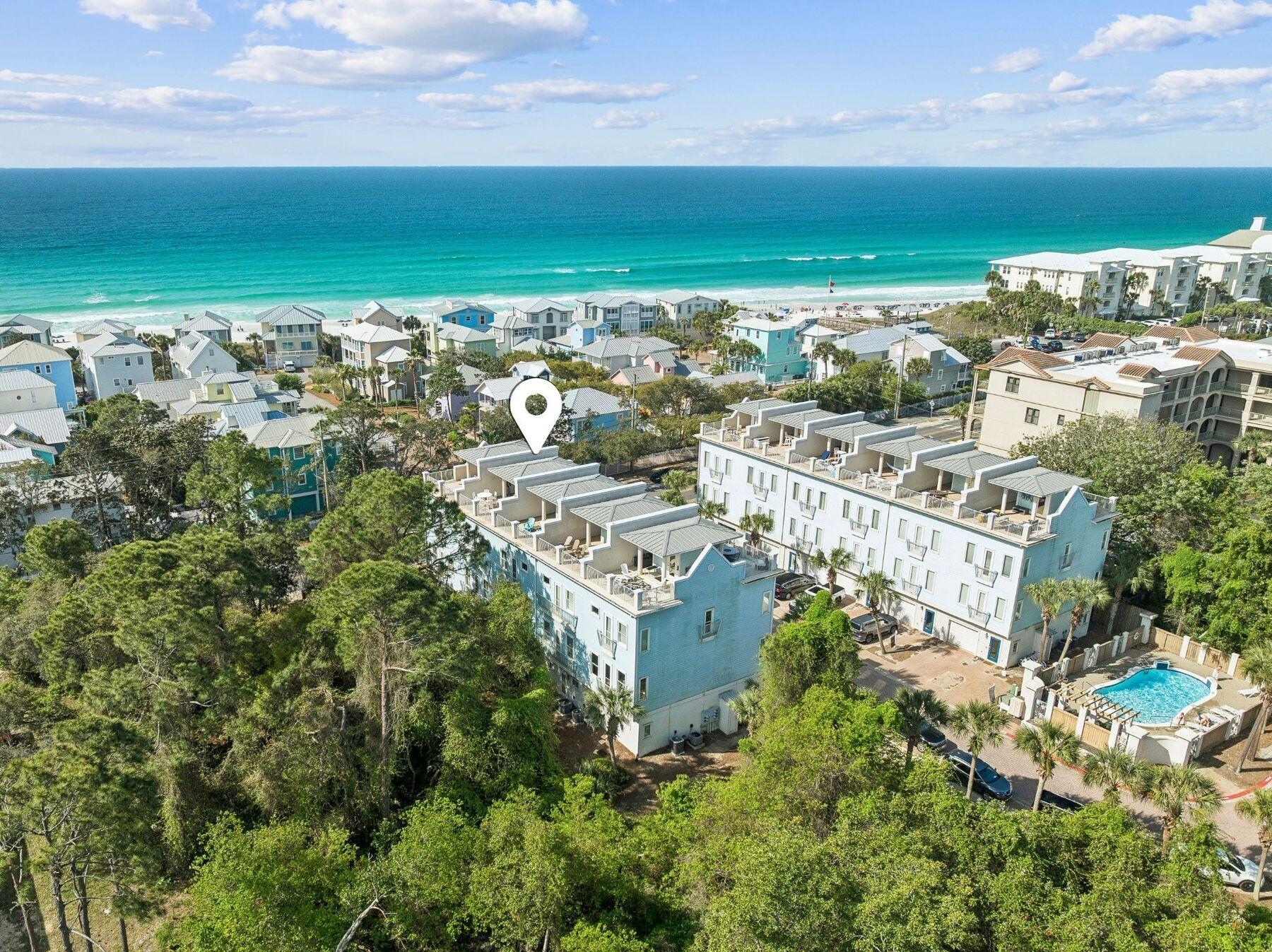 Tucked within Summer Place, a charming enclave of townhomes just off Scenic 30A, this beautifully renovated coastal residence offers an elevated take on beachside living with Gulf views, refined interiors, and exceptional outdoor living spaces creating an ideal full-time residence, second home, or investment opportunity. Spanning multiple levels, the layout is designed for both privacy and entertaining, with carefully curated spaces that balance comfort and style throughout. The first level features a private guest bunk suite complete with a game table, creating the perfect gathering space or separate retreat for guests. The second level serves as the main living area, where the renovated kitchen, dining, and living spaces flow together seamlessly in a bright, open-concept design, along with a guest suite for added convenience. The third level is dedicated to the primary suite and an additional guest suite, offering a peaceful escape removed from the main living areas. Crowning the home is the rooftop deck, designed for true indoor-outdoor coastal living, featuring two separate lounging spaces with Gulf views, ample room to enjoy sunset gatherings or dine al fresco, and a beverage center with a beverage refrigerator for easy entertaining. A one-car garage, with an included golf cart, adds convenience and additional storage, completing the home's thoughtful layout and functionality. This location offers the best of the 30A lifestyle, with a community pool, multiple public beach accesses nearby and the shops, dining, and entertainment of Gulf Place just a short stroll away. Enjoy local favorites like Shunk Gulley, Papa Surf Burger Bar, Kith and Kin Coffee, and Renaissance French Restaurant, all just moments from your front door, making it easy to enjoy the walkable, coastal lifestyle that makes this area so desirable.