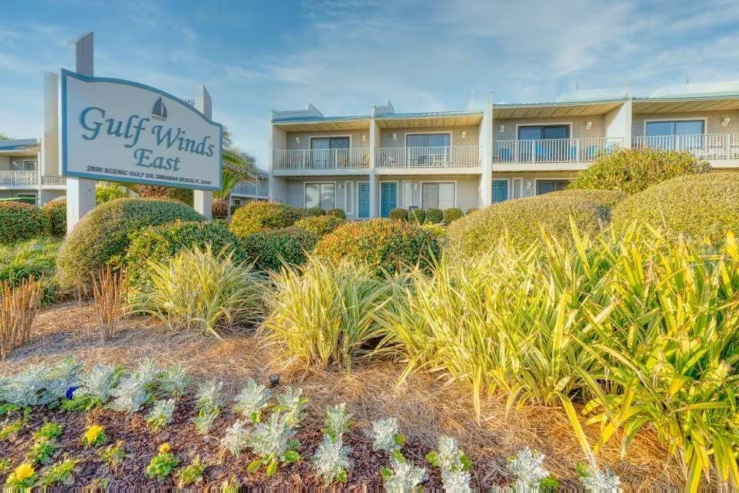 $51K+ in 2025 rental income with over $47K already booked for 2026, this freshly remodeled Gulf Winds East townhome is turnkey and income-producing. Located ~150 yards from deeded beach access with a beachfront gazebo, it features an open main level with driftwood-tone LVP, shiplap accents, quartz breakfast bar, stainless appliances, and a full bath. Upstairs, two king suites offer updated en-suites and private balconies, while bunks and a sleeper sofa sleep eight with a third full bath. Enjoy two patios, two balconies, a community pool, and walkable dining along Scenic Gulf Drive. Furnishings convey.