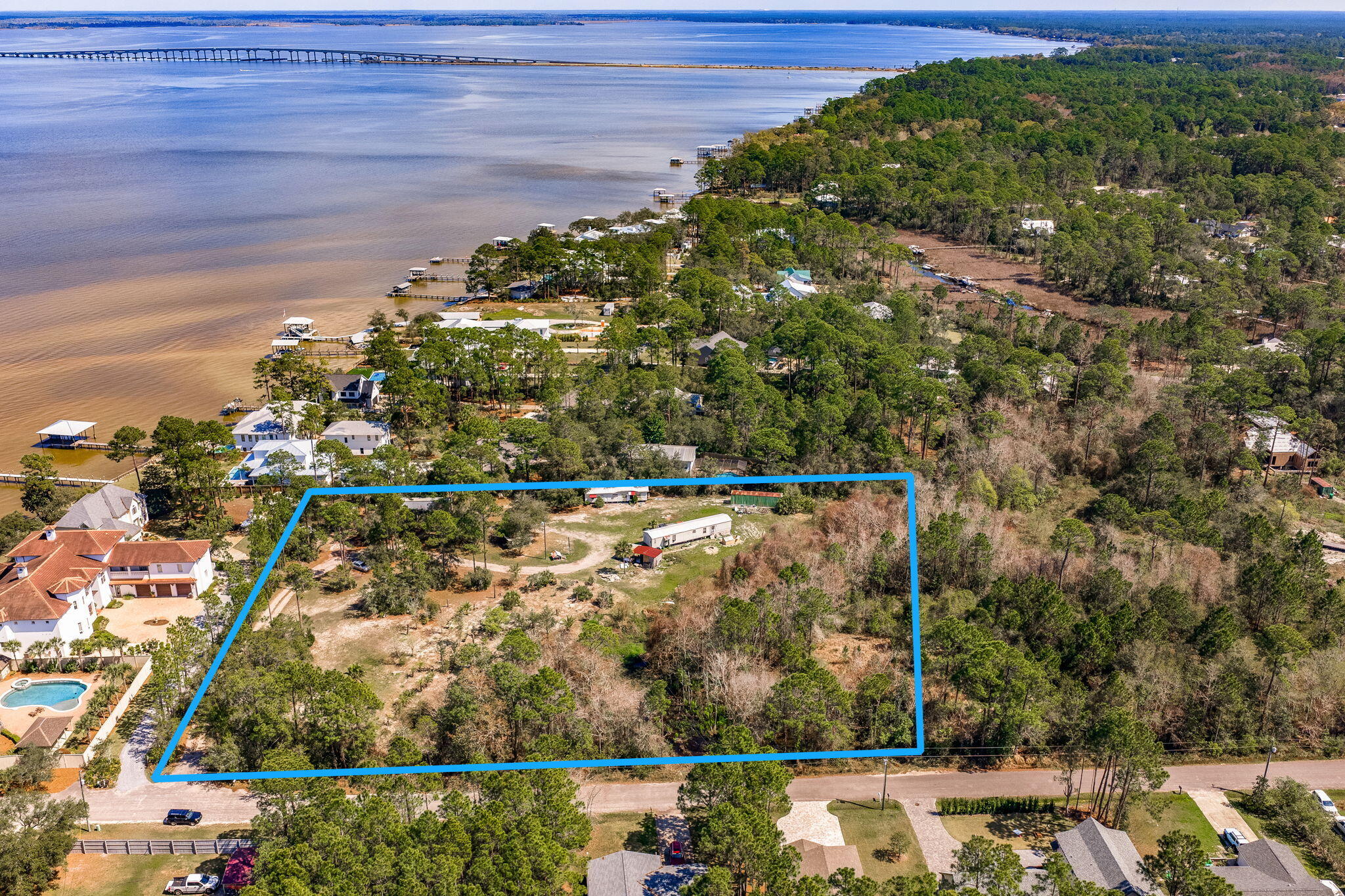 Tucked away on a quiet residential road, this beautiful 4-acre parcel located at 184 N Eden Park offers the perfect blend of privacy, natural surroundings, and prime location in Santa Rosa Beach. Zoned ''Small Neighborhood,'' the property allows up to 4 dwellings per acre--ideal for development, investment, or creating a private family compound. Partially wooded for added seclusion and charm, this property is just one block from the serene waters of Choctawhatchee Bay, offering easy access to coastal living.  Parcel contains 11.55 acres total and seller will sell 4-acres or 10-acres of the parcel and seller will retain 1.55-acres with a lot split at closing.  SELLER FINANCING AVAILABLE WITH CONSIDERABLE DOWN PAYMENT.