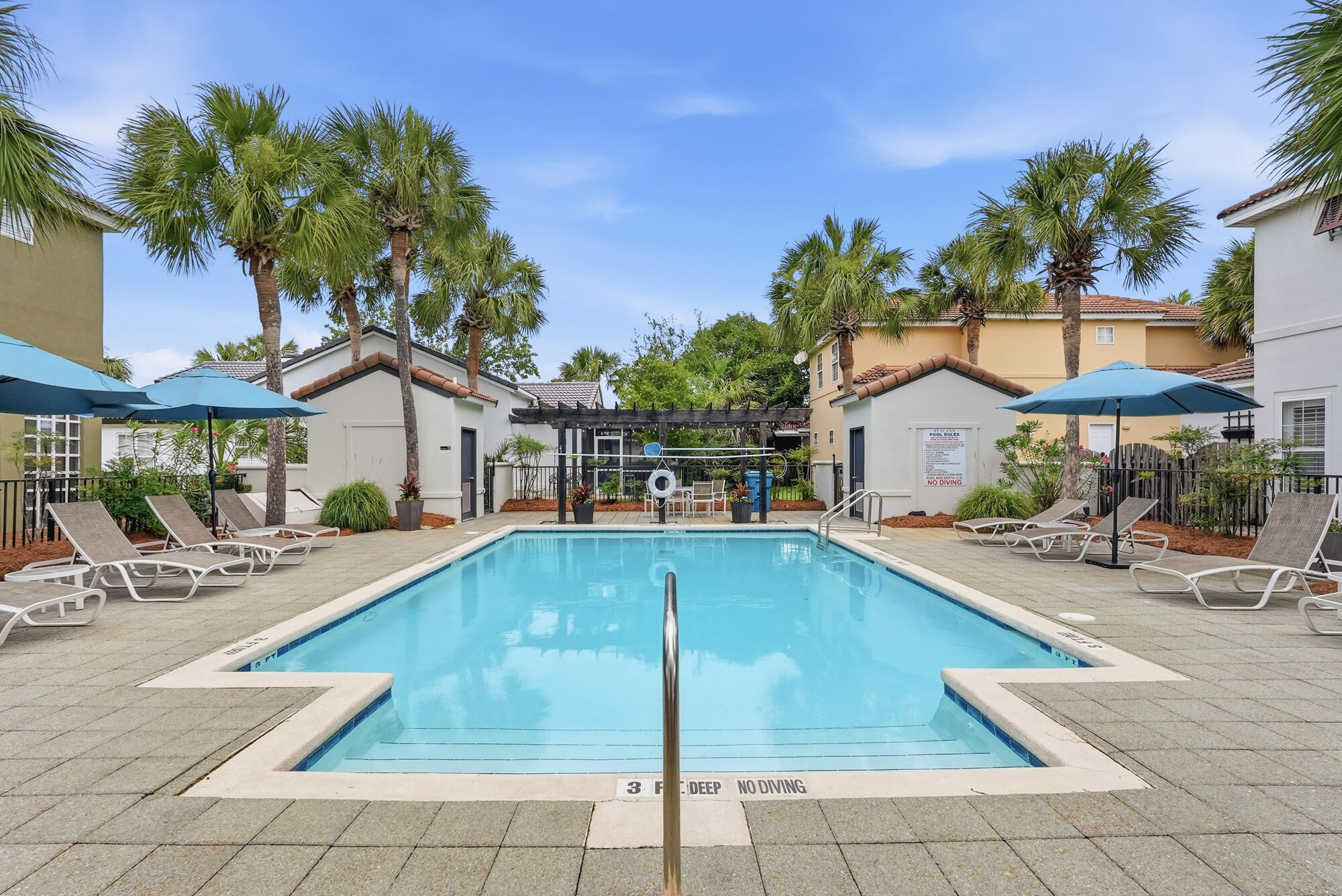 Welcome to Tuscany--one of Destin's most desirable communities, ideally located just minutes from the Emerald Coast's world-famous white sand beaches, premier dining, shopping, entertainment, and top-rated schools.

This beautifully maintained 3-bedroom, 2.5-bath home offers an inviting open-concept layout with soaring two-story ceilings that create a bright and spacious atmosphere from the moment you enter. Rich hardwood flooring flows throughout the main living area, while the well-appointed kitchen features abundant cabinet and counter space and opens seamlessly to the living and dining areas--perfect for everyday living and entertaining.

Upstairs, all three bedrooms are thoughtfully positioned for privacy, including a spacious primary suite. A screened-in back porch provides the ideal space to relax outdoors, while the private parking area offers convenience rarely found in this price range.

Located within the charming Tuscany community, residents enjoy access to a neighborhood pool and a low-maintenance lifestyle in the heart of Destin. Whether you're searching for a primary residence, second home, or investment property with a minimum one-month rental policy, this home presents an exceptional opportunity to own in one of Destin's most sought-after locations. Newer Roof, Water Heater and 7 year old Hvac.