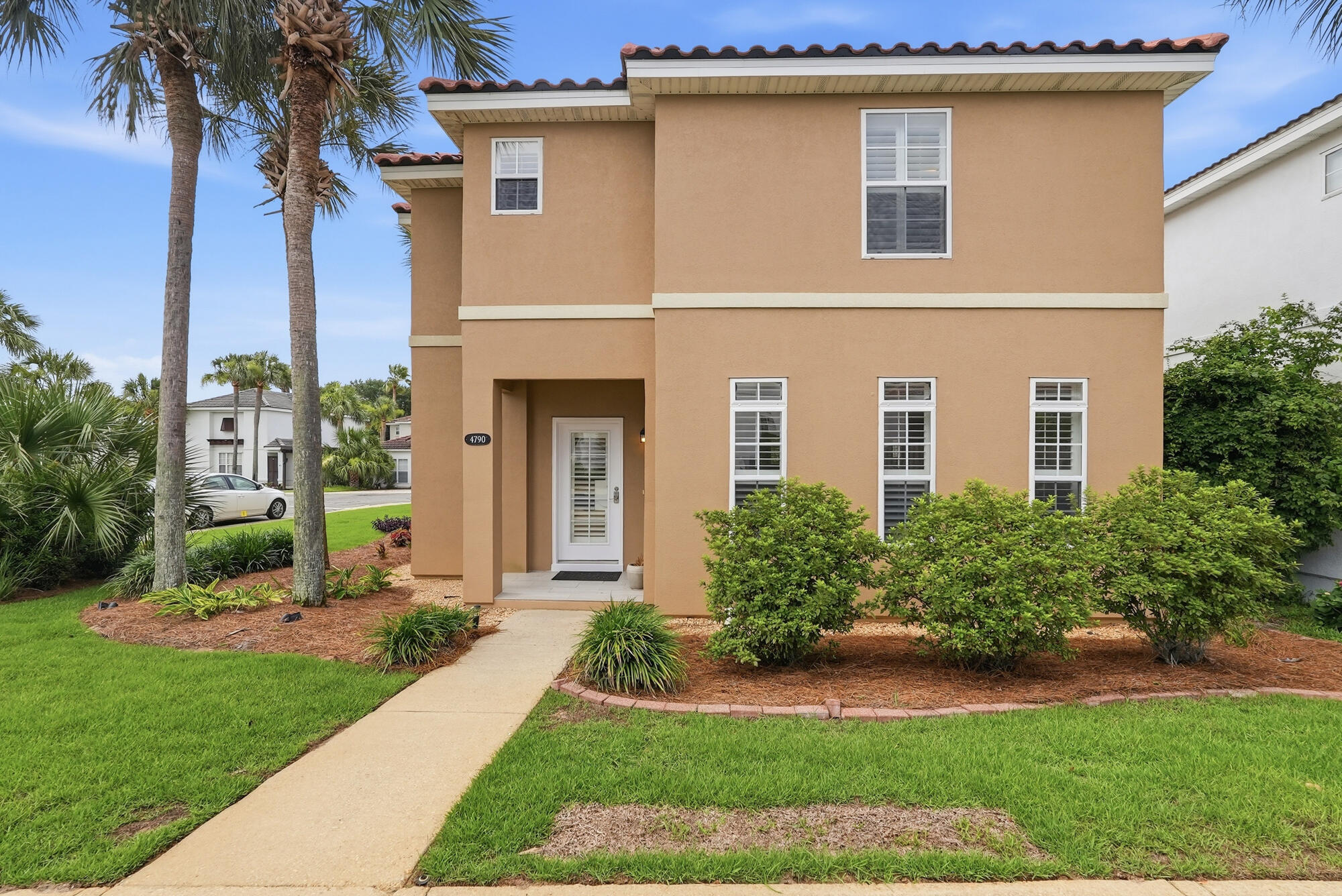 Welcome to Tuscany--one of Destin's most desirable communities, ideally located just minutes from the Emerald Coast's world-famous white sand beaches, premier dining, shopping, entertainment, and top-rated schools.

This beautifully maintained 3-bedroom, 2.5-bath home offers an inviting open-concept layout with soaring two-story ceilings that create a bright and spacious atmosphere from the moment you enter. Rich hardwood flooring flows throughout the main living area, while the well-appointed kitchen features abundant cabinet and counter space and opens seamlessly to the living and dining areas--perfect for everyday living and entertaining.

Upstairs, all three bedrooms are thoughtfully positioned for privacy, including a spacious primary suite. A screened-in back porch provides the ideal space to relax outdoors, while the private parking area offers convenience rarely found in this price range.

Located within the charming Tuscany community, residents enjoy access to a neighborhood pool and a low-maintenance lifestyle in the heart of Destin. Whether you're searching for a primary residence, second home, or investment property with a minimum one-month rental policy, this home presents an exceptional opportunity to own in one of Destin's most sought-after locations. Newer Roof, Water Heater and 7 year old Hvac.