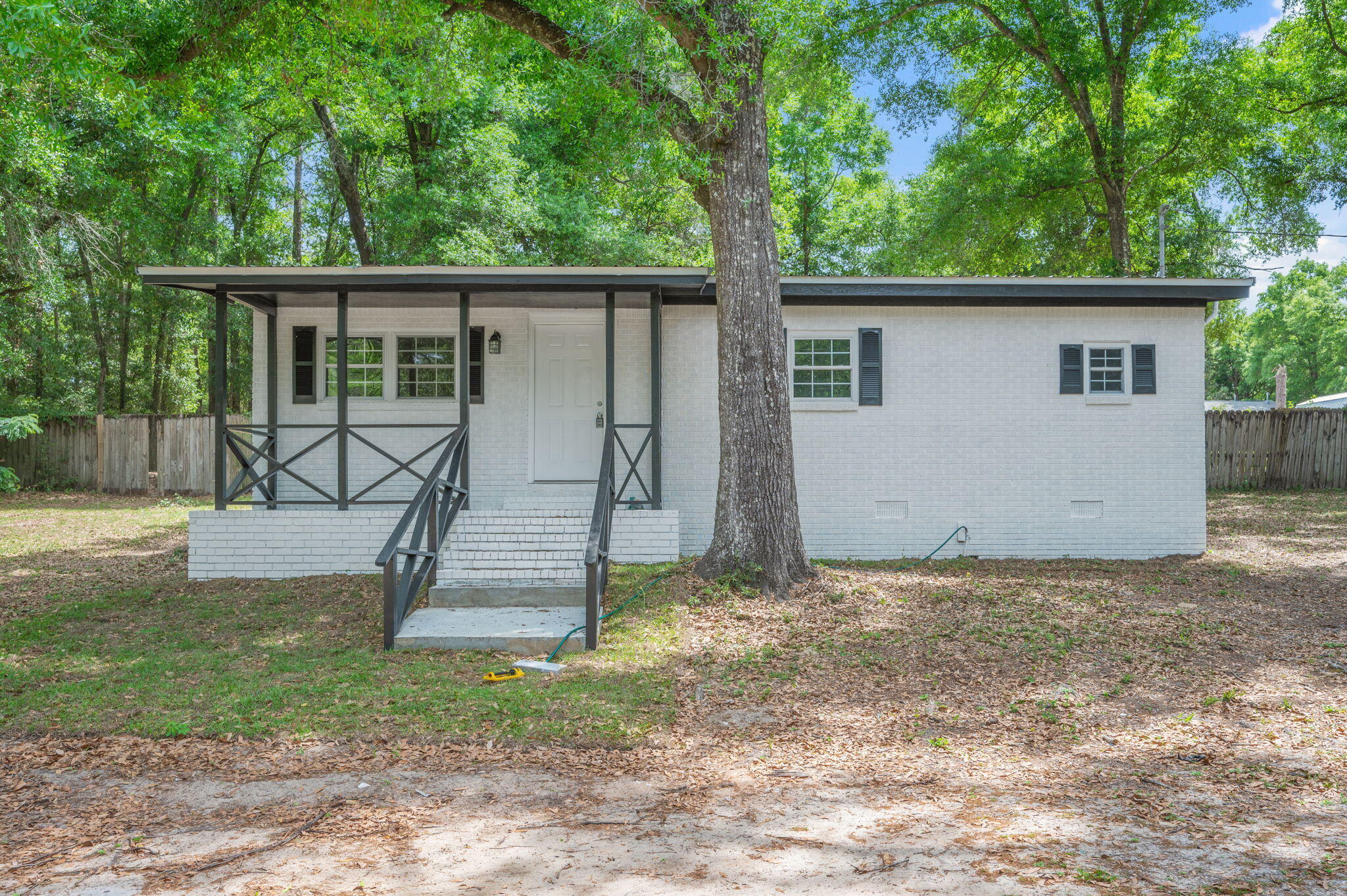 Heart of Crestview! This huge lot offers plenty of space and endless potential--perfect for those looking for room to expand, garden, or simply enjoy extra outdoor space. The property features a 2-bedroom, 1 oversized bathroom layout with a comfortable living room and dedicated dining area. Enjoy relaxing mornings or evenings on the covered front porch, along with an additional covered porch at the back of the home. Conveniently located close to schools, dining, and shopping, this property offers both charm and opportunity in a prime location.