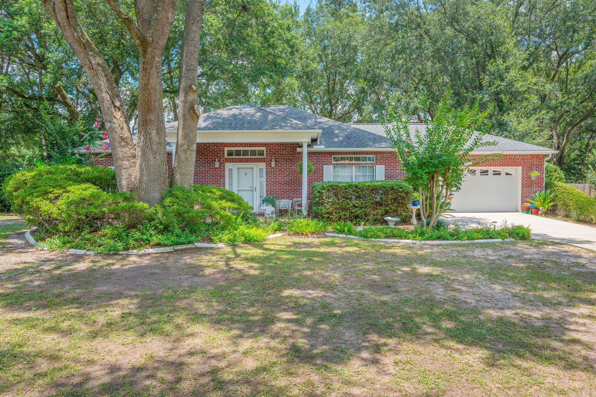 Welcome to this exceptional all-brick home located in one of North Crestview's most desirable and well-established neighborhoods. Situated on the quiet cul-de-sac of Hilary Street, this property offers privacy, convenience,established trees, and surrounding pride of ownership with beautifully maintained homes throughout the area.

Conveniently located just minutes from grocery stores, schools, shopping, local military bases, and the beautiful Emerald Coast beaches, the location offers both comfort and accessibility.

Positioned on a nicely shaded, level lot, the exterior features inviting curb appeal with a covered front porch, fully fenced backyard with wood privacy fencing, and an enclosed rear sunroom perfect for relaxing or entertaining year-round.

Inside, you'll appreciate the thoughtful design and quality finishes including raised ceilings, crown molding, tile and wood laminate flooring throughout most of the home, with carpeting in the primary suite for added comfort. The oversized kitchen features granite countertops, abundant cabinetry, and ample workspace ideal for everyday living.

Major updates include a 2019 roof, 2021 water heater, 2022 HVAC system, and drainfield replaced in 2009 ( Septic Pumped July 2026), offering peace of mind for years to come. A beautifully maintained home combining quality, comfort, and an exceptional location.