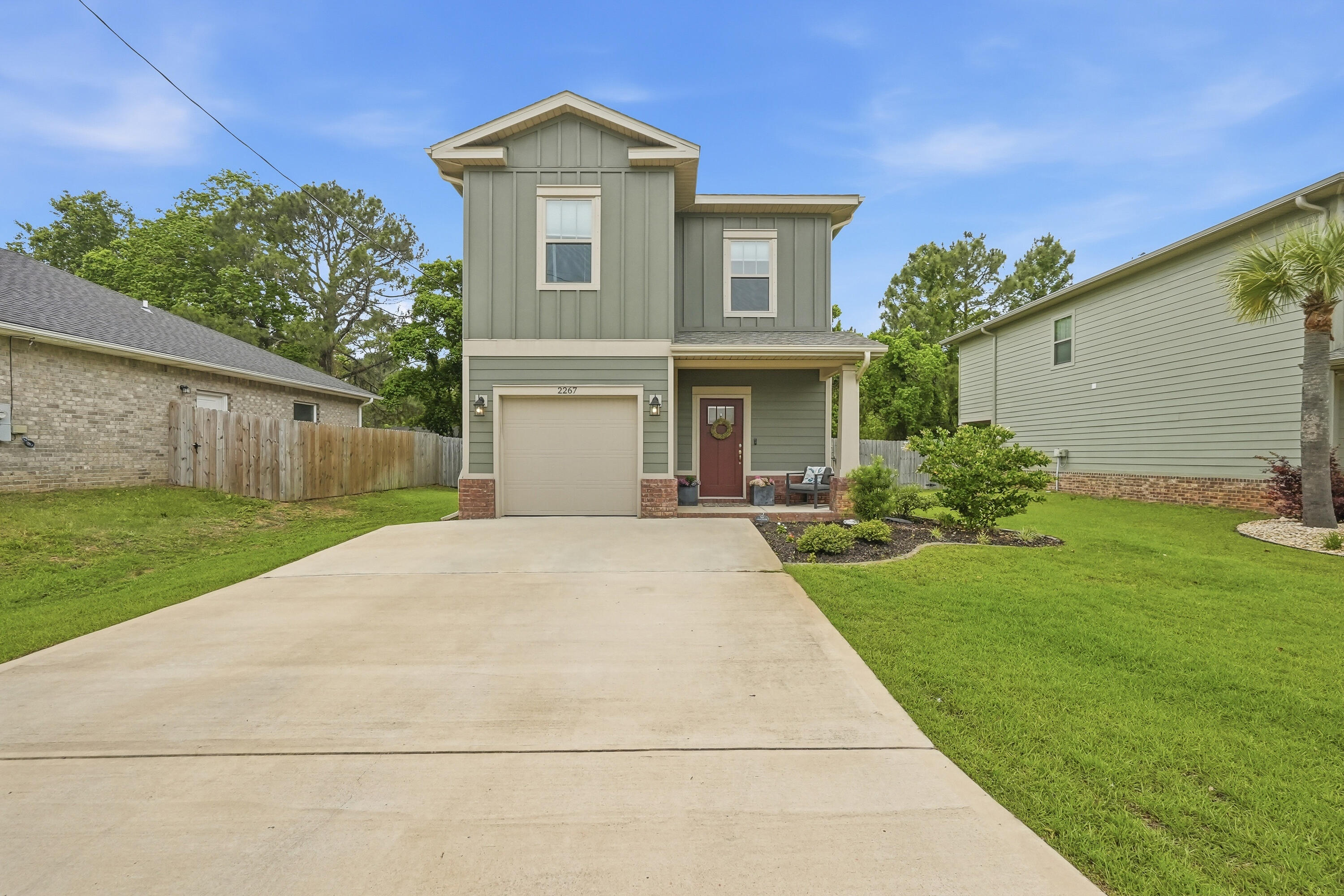 Located just minutes from Hurlburt Field in East Navarre! This exceptional two-story residence is like-new and just four years old! Showcasing thoughtful design inside and out, the exterior features cement fiber board siding complemented by timeless brick accents, an irrigation system, rain gutters, a fully fenced backyard for added privacy and a large, covered patio. Inside, the home offers luxury vinyl plank flooring throughout the main living areas on the first floor, elegant neutral tile in the bathrooms, and comfortable carpeting in the bedrooms. Additional features in this open concept plan include a welcoming entryway with transom accent window, coat closet, guest half-bath, tall ceilings, wide baseboards, crown molding, and a dedicated dining area. The beautifully appointed kitchen is complete with stainless steel appliances, tile backsplash, shaker-style soft close cabinetry, granite countertops, a walk-in pantry and an oversized island with pendant lights and breakfast bar seating. VA assumable loan for qualified buyer! This home has it all!