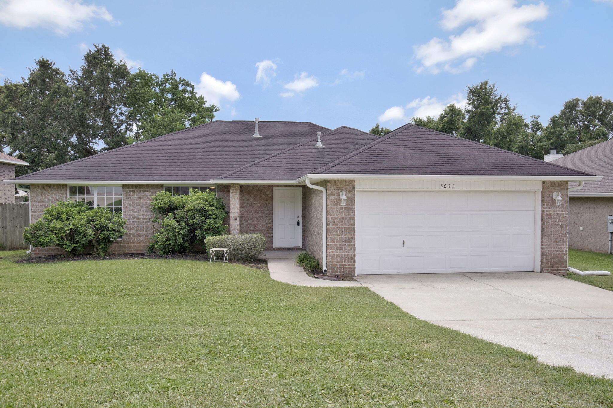**Stunning Brick Home in Pensacola's Desirable Floridian Subdivision**

Welcome home to this beautiful, move-in ready single-family residence perfectly situated in the highly sought-after Floridian neighborhood. Boasting 3 bedrooms, 2 bathrooms, and a spacious 1,969 square feet of living space, this home blends lasting durability with functional modern comfort. From the moment you arrive, the timeless curb appeal of the full brick facade welcomes you inside a thoughtfully configured floor plan. The expansive living area serves as the heart of the home, featuring a cozy fireplace that anchors the space--perfect for peaceful evenings or entertaining guests. The kitchen flows seamlessly into the dining and living spaces, equipped with an integrated suite including a built-in microwave, dishwasher, range, and refrigerator. Retreat to the generous primary suite, or utilize the additional bedrooms for family, guests, or a dedicated home office. Step outside to a substantial 9,452 sq. ft. lot that offers plenty of open (fenced in) space for weekend activities, gardening, or outdoor dining. The property also features an attached 2-car garage for seamless parking and storage. Rest assured with a BRAND NEW ROOF being installed July 2026!  Conveniently located in Central Escambia County right off Blue Angel Parkway, you are just a short drive from NAS Pensacola, beautiful local beaches, shopping, and dining. Don't miss your chance to own a piece of the Floridian communi
