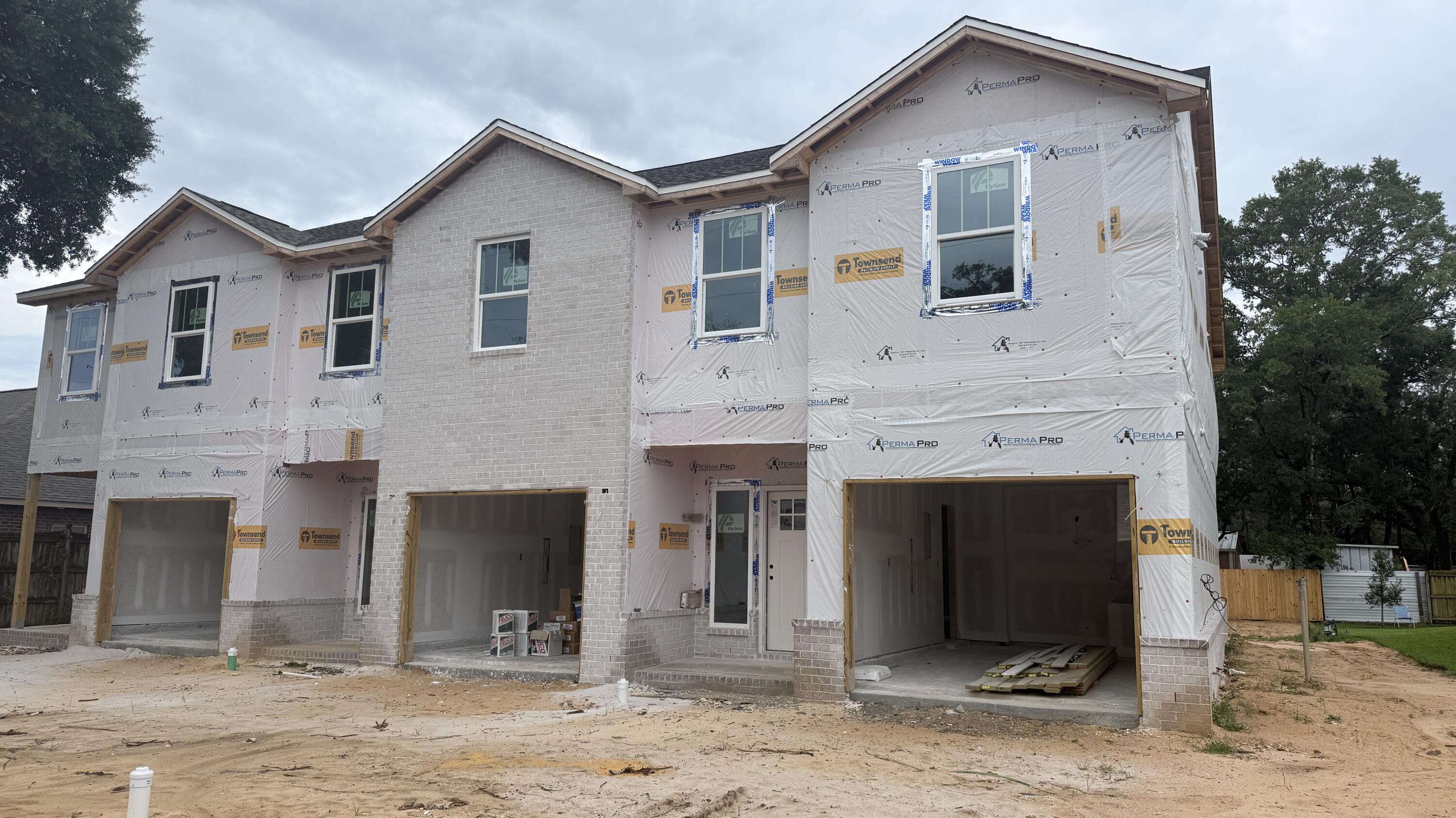 BRAND NEW END-UNIT townhome conveniently close to Bases, Beaches & Shopping! 3 bedrooms, 2.5 baths and 1,517 square feet of beautifully designed living space with NO HOA!  Builder is offering $12,000 in ''ANY WAY'' money that can be used toward closing costs and/or an interest rate buy-down! Built with impact glass windows for added storm protection and potential insurance savings, this spacious open-concept home features a large living and dining area, attached 1-car garage, half bath, and a stylish kitchen complete with stunning quartz countertops, stainless steel appliances including a refrigerator with ice maker, smooth-top range, built-in microwave, quiet dishwasher, breakfast bar seating, and dining area. Upstairs you'll find a generous primary suite with private sitting area, walk-in closet, and en-suite bath, along with two additional bedrooms, a full guest bath, and convenient upstairs laundry. Washer and dryer are included! Luxury Vinyl Plank flooring will be everywhere except the two guest bedrooms and the stairway.  Relax and entertain on the back patio overlooking the large 134-foot-deep Privacy Fenced backyard. Thoughtfully designed with comfortable room sizes, great storage, and modern finishes throughout--call today to schedule your private showing!  Projected completion is the end of July. ROOM SIZES ARE APPROXIMATE