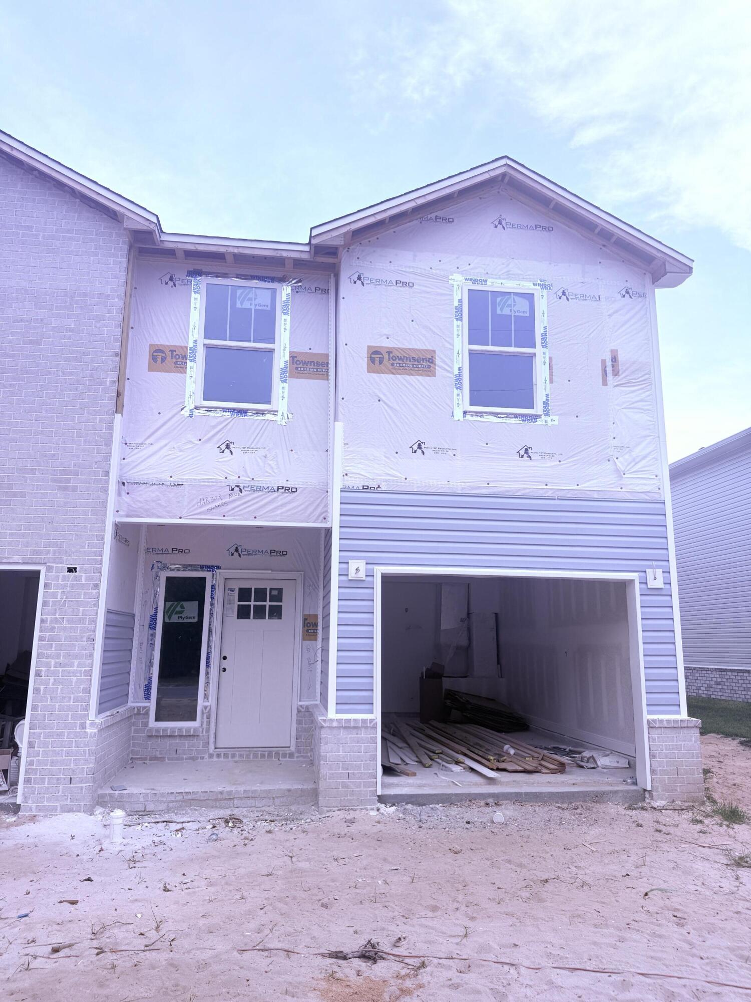 BRAND NEW END-UNIT townhome conveniently close to Bases, Beaches & Shopping! 3 bedrooms, 2.5 baths and 1,517 square feet of beautifully designed living space with NO HOA!  Builder is offering $12,000 in ''ANY WAY'' money that can be used toward closing costs and/or an interest rate buy-down! Built with impact glass windows for added storm protection and potential insurance savings, this spacious open-concept home features a large living and dining area, attached 1-car garage, half bath, and a stylish kitchen complete with stunning quartz countertops, stainless steel appliances including a refrigerator with ice maker, smooth-top range, built-in microwave, quiet dishwasher, breakfast bar seating, and dining area. Upstairs you'll find a generous primary suite with private sitting area, walk-in closet, and en-suite bath, along with two additional bedrooms, a full guest bath, and convenient upstairs laundry. Washer and dryer are included! Luxury Vinyl Plank flooring will be everywhere except the two guest bedrooms and the stairway.  Relax and entertain on the back patio overlooking the large 134-foot-deep Privacy Fenced backyard. Thoughtfully designed with comfortable room sizes, great storage, and modern finishes throughout--call today to schedule your private showing!  Projected completion is the end of July. ROOM SIZES ARE APPROXIMATE