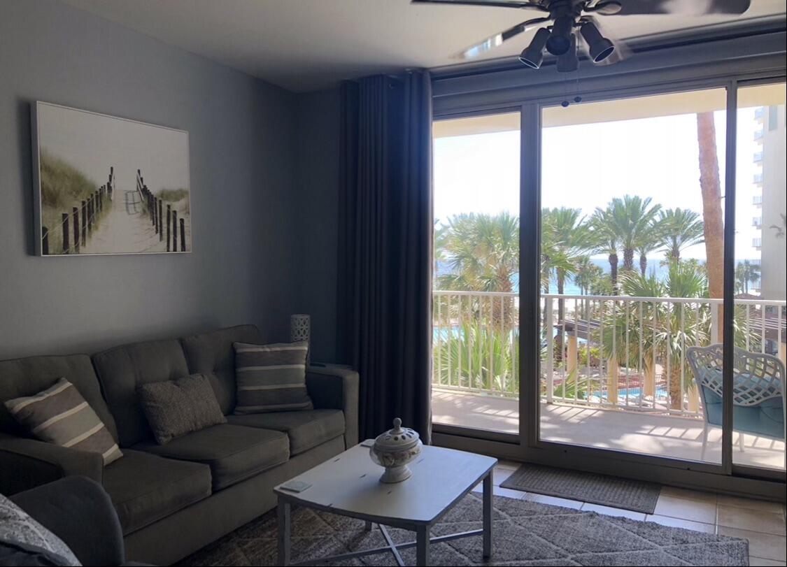 This beautifully decorated, beach-inspired 1BR + bunks Gulf-front condo is rental-ready. Enjoy sweeping views from your third-floor patio overlooking a resort-style pool with tiki huts, zero-entry design, palm trees, and ample lounge space. A private dock provides easy access across white sand to the emerald Gulf waters. Amenities include an indoor pool, spa, fitness center, and secure parking garage. Shores of Panama is undergoing a cosmetic refresh, adding future value. Ideal as an investment, primary residence, or vacation home, and just steps from the pier, dining, and conveniences, this condo has already demonstrated proven rental potential.