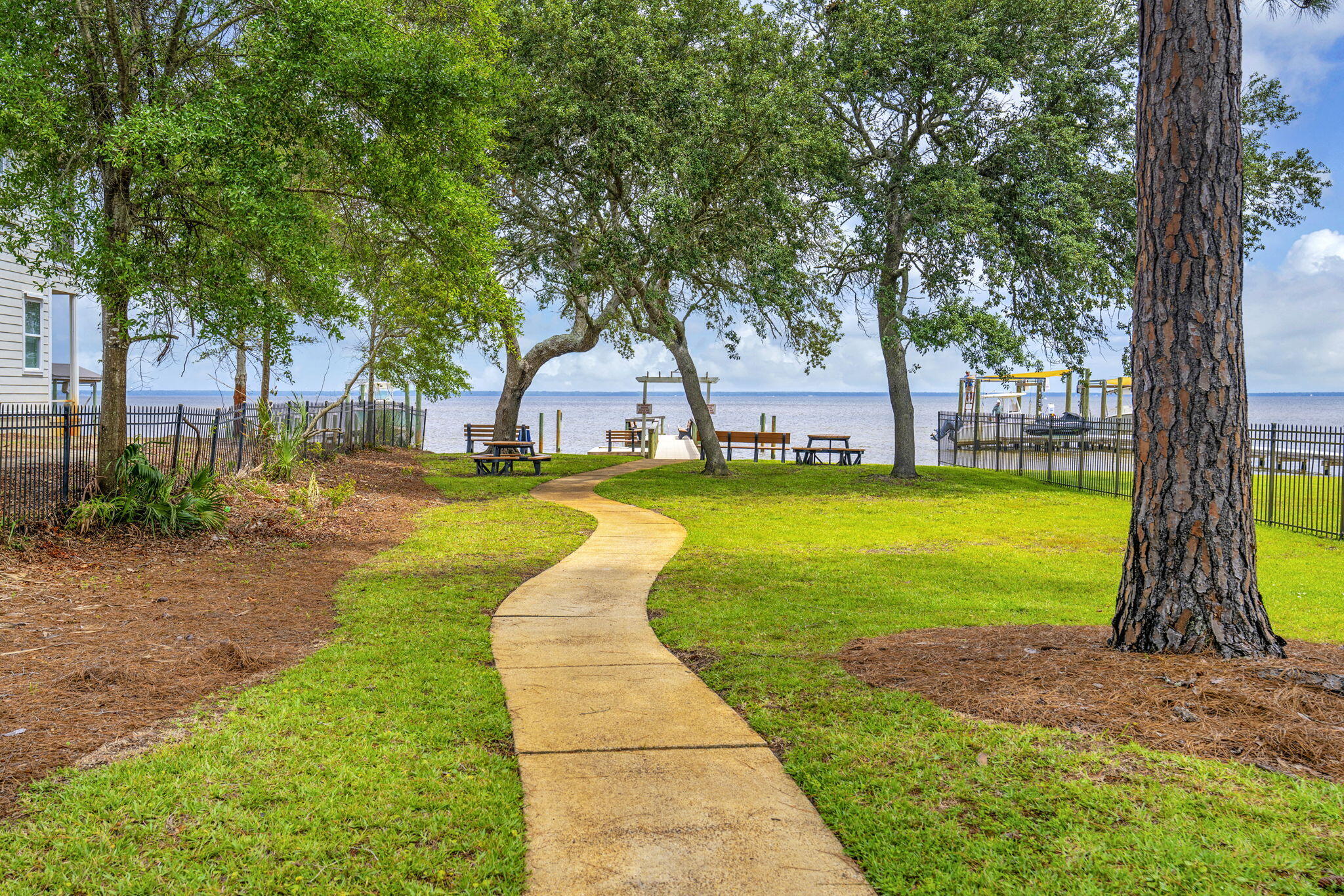 Looking for an immaculate one-story home with a spacious fenced backyard? Welcome to 401 Pelican Bay Drive, a thoughtfully designed residence built in 2020 and offered in turnkey condition.

Freshly painted throughout, this move-in ready home offers 3 bedrooms, an office/flex space, 2 full baths, powder bath, and a well-designed floor plan that combines everyday comfort with effortless entertaining. The open-concept living area flows seamlessly into the kitchen, where an oversized island, abundant cabinetry, and generous dining space create a natural gathering place for family and friends.

Privately situated at the back of the home, the primary suite features a spacious bath and walk-in closet, while the secondary bedrooms share a convenient Jack-and-Jill bath. The dedicated office/flex space provides versatility for working from home, hobbies, or even additional guest accommodations.

Step outside to enjoy one of the home's standout features--a spacious fenced backyard with plenty of room for pets, play, gardening, or future outdoor enhancements. Just a short distance away, residents enjoy Pelican Bay's Bayfront Park, offering a fishing pier, waterfront gathering areas, and access to the natural beauty of Choctawhatchee Bay.

Pelican Bay is a highly desirable bayfront community that is in the process of becoming fully gated, further enhancing the privacy and appeal of the neighborhood. Conveniently located near Sacred Heart Hospital, Grand Boulevard, and Beaches of 30A.