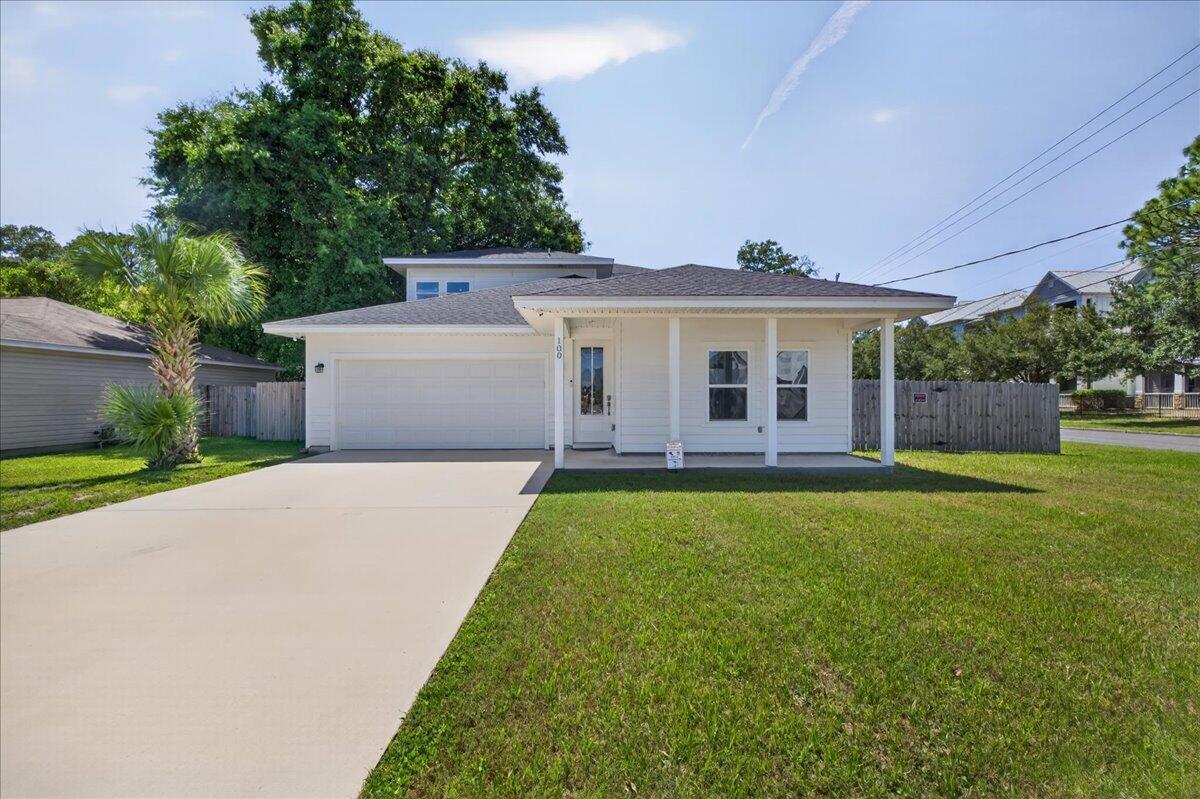 This stunning 2022-built home offers 4 bedrooms, 3 bathrooms, and modern coastal living!
Situated on a corner lot, the covered front porch and crisp white exterior set the tone for what's inside. Step through the front door and into a bright, open-concept living and dining area featuring luxury vinyl plank flooring throughout and an abundance of natural light.
The kitchen is sure to impress, boasting white shaker cabinetry with crown molding, quartz countertops, a large kitchen island with sink and breakfast bar, stainless steel appliances, and stylish pendant lighting -- all open to the main living area and perfect for entertaining.
The primary suite is conveniently located on the main floor and features a spacious walk-in closet and a spa-like ensuite bath complete with a double vanity, quartz countertops, brushed gold fixtures, and a stunning oversized walk-in shower adorned with floor-to-ceiling marble-look tile, dual showerheads, built-in niches, and hexagon mosaic tile flooring.
Upstairs, you'll find a bright, open den area -- ideal as a home office, playroom, or flex space -- along with two additional bedrooms, each with ample closet space and LVP flooring. A secondary bathroom with quartz countertops and a tub/shower combo serves the upper level.
Out back, enjoy a large fully fenced backyard with a covered patio, and firepit. A 2-car attached garage completes this gorgeous home.
Ideally situated with an easy commute to local military bases, gorgeous white sand beaches , downtown Fort Walton Beach, and an array of restaurants and shopping.