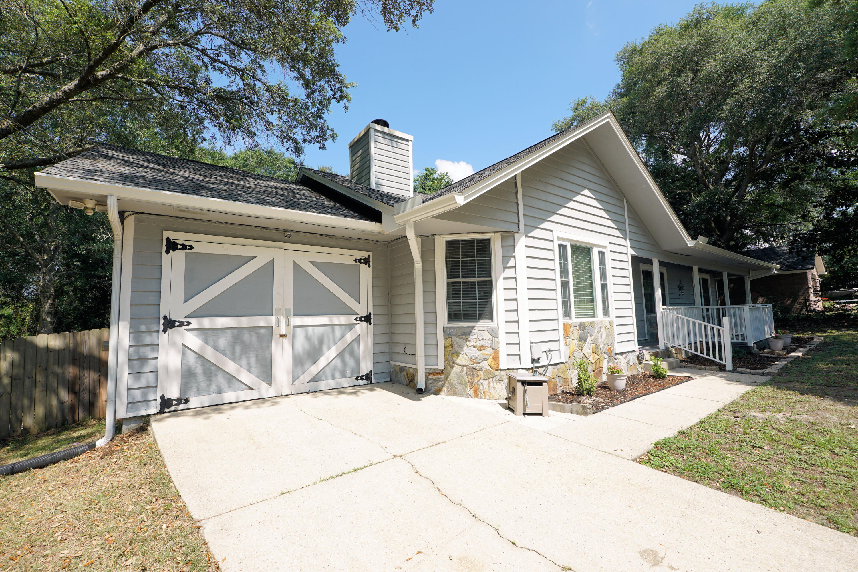 Ideally situated south of I-10, this home features a distinct Southern Living style with its deep setback, mature oak trees, long concrete driveway, and a picturesque exterior that provides fantastic curb appeal. The location is incredibly convenient for anyone looking to cut down on traffic, offering a straightforward connection to the I-10 interchange, Eglin AFB, Duke Field, and 7th Special Forces Group.
The home comes with a clear timeline of major structural and mechanical updates. The A/C system was replaced in March 2022, and a new roof and gutters were installed in April 2024. To complete the mechanical upgrades, a brand-new water heater is scheduled for installation in June 2026.
Inside, the floor plan is filled with practical, custom upgrades. The kitchen and dining area include a built-in dining bench and an integrated pantry for extra storage. The kitchen features a brand-new stove installed in June 2026, and the refrigerator will also convey with the sale. Both bathrooms have been updated. The guest bath features a custom board-and-batten accent wall, while the primary suite includes a custom tiled standing shower, shiplap wall detailing, and a redone walk-in closet with built-ins. For extra utility, the garage conversion offers a dedicated, accessible bonus room that can easily serve as whatever you need.
The outdoor space is a standout feature of the property. The large covered deck overlooks a great, spacious backyard secured by a privacy fence installed between 2022 and 2023. For outdoor entertainment, the deck leads down to a concrete patio that features a dedicated space under the custom pergola for a fire pit.
With a large lot, distinctive custom features, and the big-ticket mechanical updates already completed, this no-HOA home puts you south of the I-10 traffic bottleneck--schedule your private tour today.