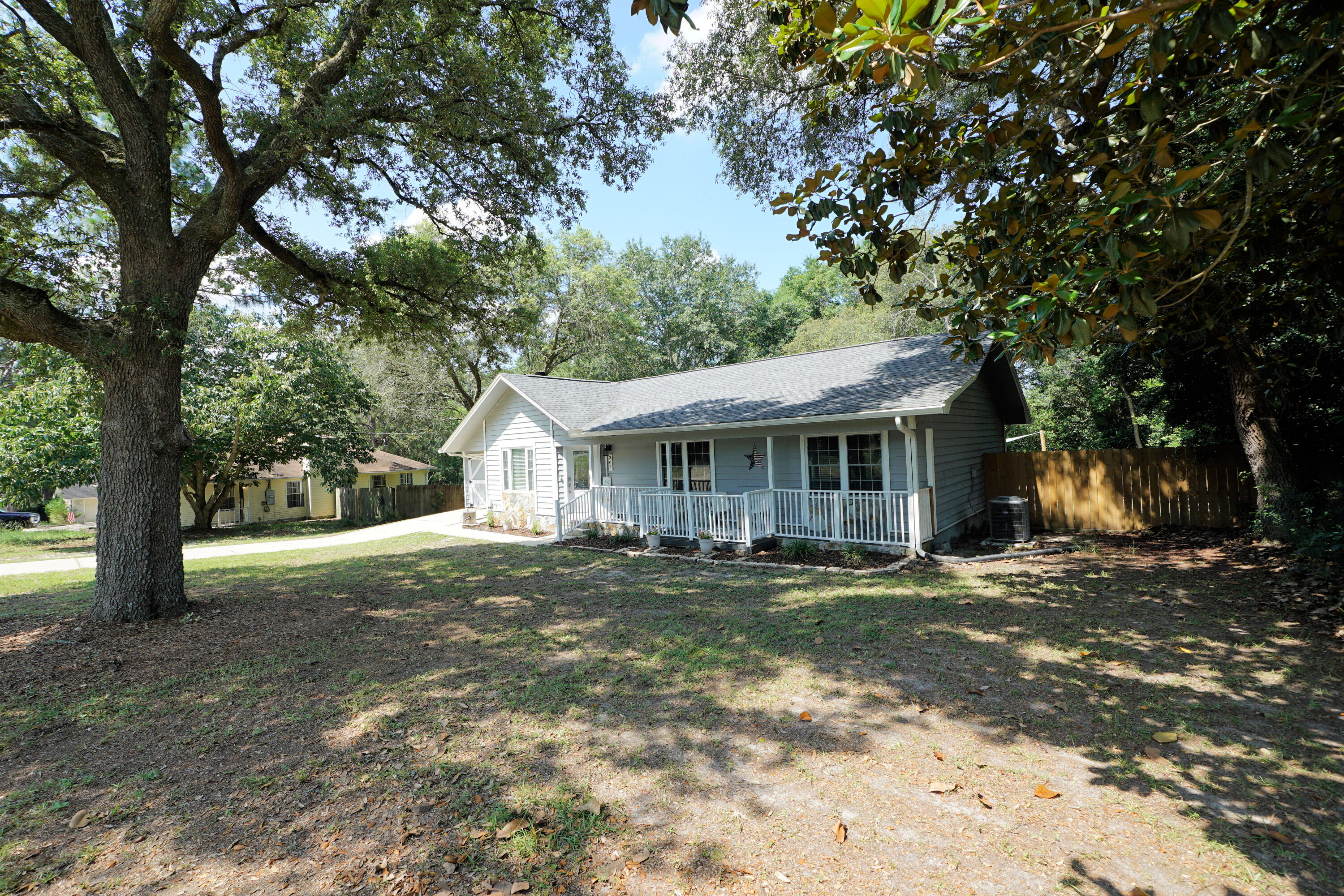 Ideally situated south of I-10, this home features a distinct Southern Living style with its deep setback, mature oak trees, long concrete driveway, and a picturesque exterior that provides fantastic curb appeal. The location is incredibly convenient for anyone looking to cut down on traffic, offering a straightforward connection to the I-10 interchange, Eglin AFB, Duke Field, and 7th Special Forces Group.
The home comes with a clear timeline of major structural and mechanical updates. The A/C system was replaced in March 2022, and a new roof and gutters were installed in April 2024. To complete the mechanical upgrades, a brand-new water heater is scheduled for installation in June 2026.
Inside, the floor plan is filled with practical, custom upgrades. The kitchen and dining area include a built-in dining bench and an integrated pantry for extra storage. The kitchen features a brand-new stove installed in June 2026, and the refrigerator will also convey with the sale. Both bathrooms have been updated. The guest bath features a custom board-and-batten accent wall, while the primary suite includes a custom tiled standing shower, shiplap wall detailing, and a redone walk-in closet with built-ins. For extra utility, the garage conversion offers a dedicated, accessible bonus room that can easily serve as whatever you need.
The outdoor space is a standout feature of the property. The large covered deck overlooks a great, spacious backyard secured by a privacy fence installed between 2022 and 2023. For outdoor entertainment, the deck leads down to a concrete patio that features a dedicated space under the custom pergola for a fire pit.
With a large lot, distinctive custom features, and the big-ticket mechanical updates already completed, this no-HOA home puts you south of the I-10 traffic bottleneck--schedule your private tour today.