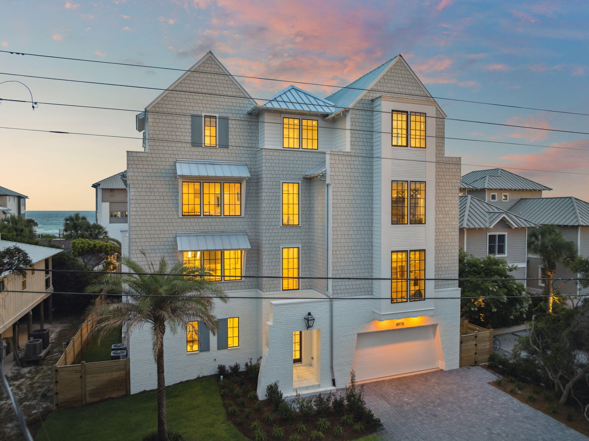 Introducing 8978 E County Highway 30A -- a remarkable Gulf-view beach home offering 6,300+ sq ft of thoughtfully designed interior space and 1,800+ sq ft of outdoor living. Features include 9 bedrooms, 7 full baths, 2 half baths, expansive covered terraces with Gulf views, and a chef's kitchen with premium appliances and an oversized island. Modern, timeless finishes throughout. The first floor features a spacious recreation room that opens to a covered patio, pool, and built-in grill, offering a private setting for leisure and entertainment. On the second floor, the main living area is bathed in natural light and oriented to take full advantage of surrounding views.

The third floor offers a bunk room, additional living area, and guest bedrooms each with a private porch or balcony and Gulf-facing views. Upstairs, the fourth floor includes a quiet landing with a built-in daybed and a luxurious primary suite featuring a private balcony, walk-in closet, and spa-inspired bathroom with soaking tub and glass-enclosed shower.

Additional highlights include two laundry rooms and an elevator for added convenience. This property is well-suited as a full-time residence, vacation getaway, or rental investment, offering versatility and space in a sought-after 30A location.

Located within convenient reach of dining, shopping, and recreation along 30A.

*** All information and dimensions to be verified by buyer.