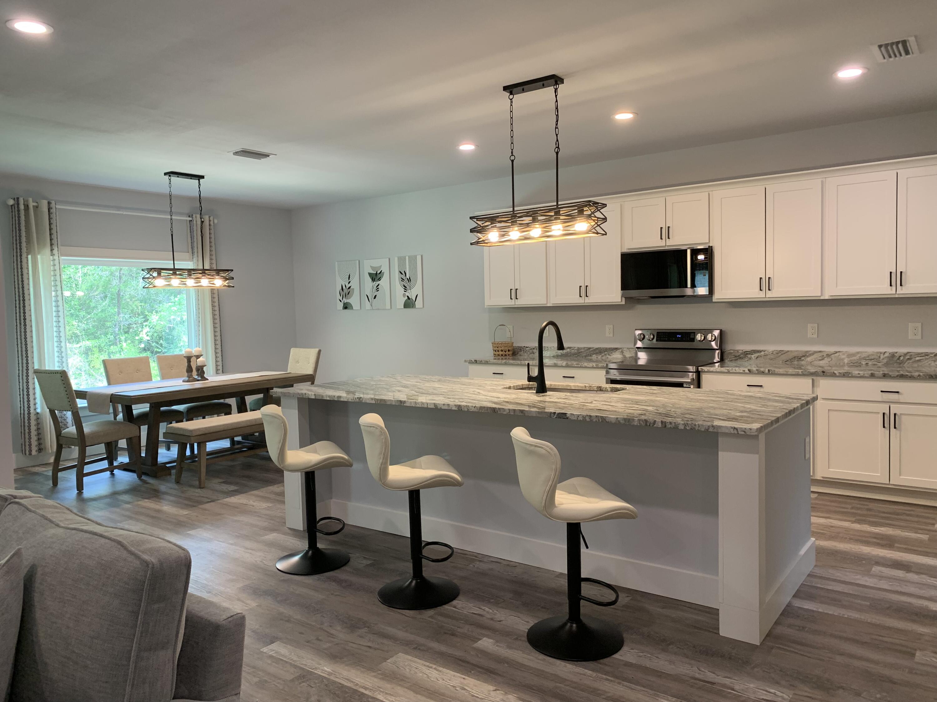 Newly Built, Furnished Home in the Heart of Freeport, Florida

Move-in ready and furnished, this newly built 3-bedroom, 2-bathroom home offers modern comfort, style, and convenience in the heart of Freeport. The spacious open-concept floor plan features a large kitchen with stainless steel appliances, walk-in pantry, granite countertops, and abundant cabinet and counter space, making it ideal for entertaining and everyday living.

The home showcases attractive and durable LVL flooring throughout the main living areas, with tile flooring in both bathrooms for added style and easy maintenance. The primary suite provides a private retreat, while two additional bedrooms offer flexibility for family, guests, or a home office.

Being sold furnished, this turnkey property is perfect as a primary residence, vacation home, or investment opportunity. Conveniently located near shopping, dining, schools, and just a short drive from the beautiful beaches and outdoor recreation of Florida's Emerald Coast.

Buyer to verify all measurements.