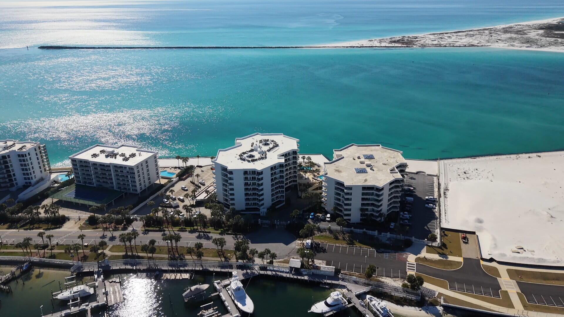 From the moment you walk in you'll fall in love with this beautiful & affordable Coastal Inspired Condo with its view of Destin Harbor, High-End Finishes & Large Balcony! Unit 126 is conveniently located to all the key amenities (Private Beach, Pool, Fitness Center, Club Room, Private Covered Parking Space & Personal Storage Unit) to provide an excellent 'Quality of Life'. East Pass Towers looks great and is in outstanding shape having just completed a major renovation with all assessments being paid for by the current owner. The Complex is gated/fenced for security with beautifully landscaped grounds. Looking for an easy Florida Lifestyle? You've found it! Come see it today...make it yours... and love it forever!! Owners are offering a $10,000 furniture allowance with an acceptable offer.