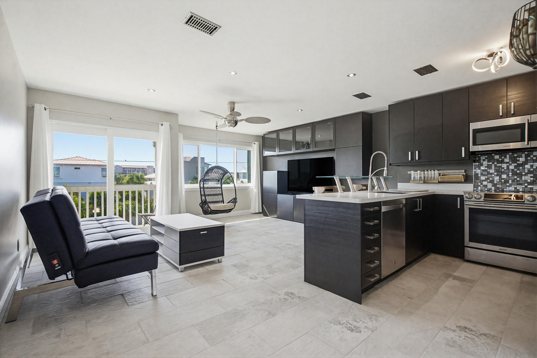 Freshly Painted Interior~Ceiling, Walls, Doors & Trim beautifully updated. Now is Your chance to Snag this Sweet Condo in a Great Location, walk, bike or golf cart to the beach! Superb Destin position, Ideally located near multiple beach access points, including 2 private deeded accesses for your stroll to the sugar-white sands & crystal-clear waters. The exterior was fully made over in 2024, featuring new staircases & a fresh coastal look, while the interior has been tastefully remodeled with sleek, modern finishes. A custom built-in wall of cabinetry in the bedroom maximizes storage and space. With low carrying costs, this property is a smart investment whether you're looking for a short- or long-term rental, or your own full time residence living the saltlife!