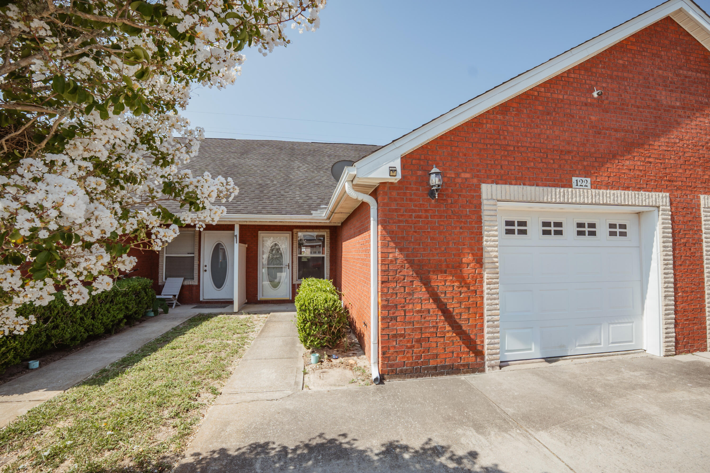 Available Now!!!......3/2 Town Home in Destin features move in ready home. Floor plan boasts laminate flooring and like new feel throughout the home. Centrally located in Destin for easy commute to bases, beaches, and shopping. Beautiful laminate wood flooring in the home with master bedroom and bathroom on the first level. Galley kitchen with white appliances. New paint on the walls with plenty of natural light.  Access to the open back patio for outdoor grilling from the kitchen area.  Breakfast bar and eat in kitchen area.  Over-sized driveway for parking with washer and dryer hook ups in the garage.  No inside smoking or vaping. Pets allowed with a non-refundable pet fee and owner approval only.  Minutes from the beaches of the Emerald Coast.