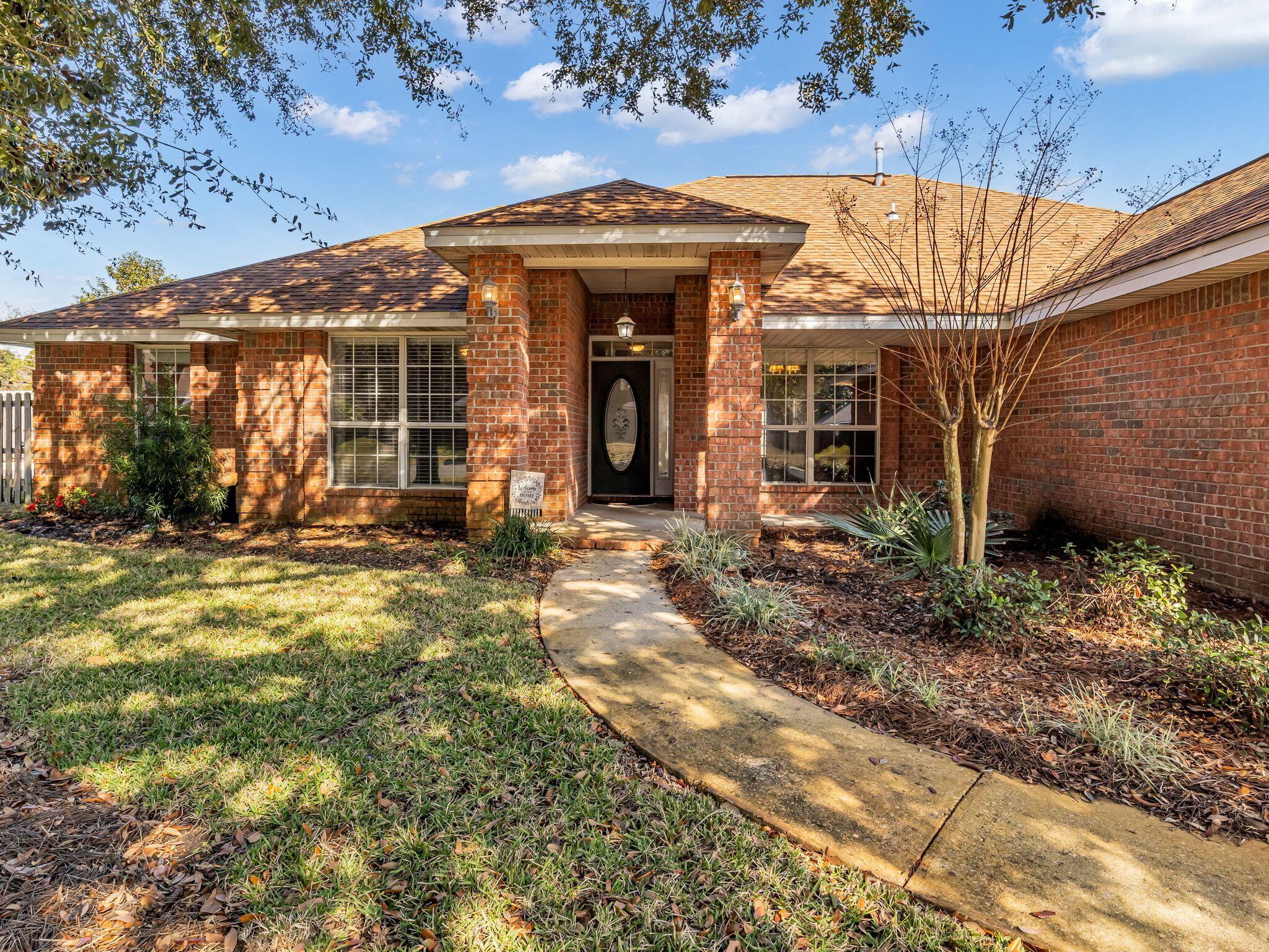 Excellent Value For Brick Home w/ Backyard Pool! Hidden Pines Subdivision Is In Heart Of Destin. Entrance Foyer Opens To Large Great Room w/ Lofted Ceiling. Beautiful Kitchen w/ Upgraded Cabinets & Granite Counters. Stainless Appliances Including Dual Fuel (Electric & Gas) Stove/Oven. Breakfast Area w/ Bay Window in Kitchen. Separate Formal Dining Room & Spacious Home Office/Den/Flex Room w/ Built In Shelving. Primary BR Is Large & Separate From Other BR's. Primary Bath Has 2 Showers(!), Double Vanity, & 2 Walk In Closets. On Far Side Of Home Are 3 Guest BR's & A Full Guest Bathroom. New Roof in 2022! NO CARPET - Tile & Laminate Flooring Throughout. Roomy 2 Auto Garage w/ Cabinets For Storage. Backyard Has Paver Stone Patio On Way To Kidney Shaped Pool. Take A Look Today!